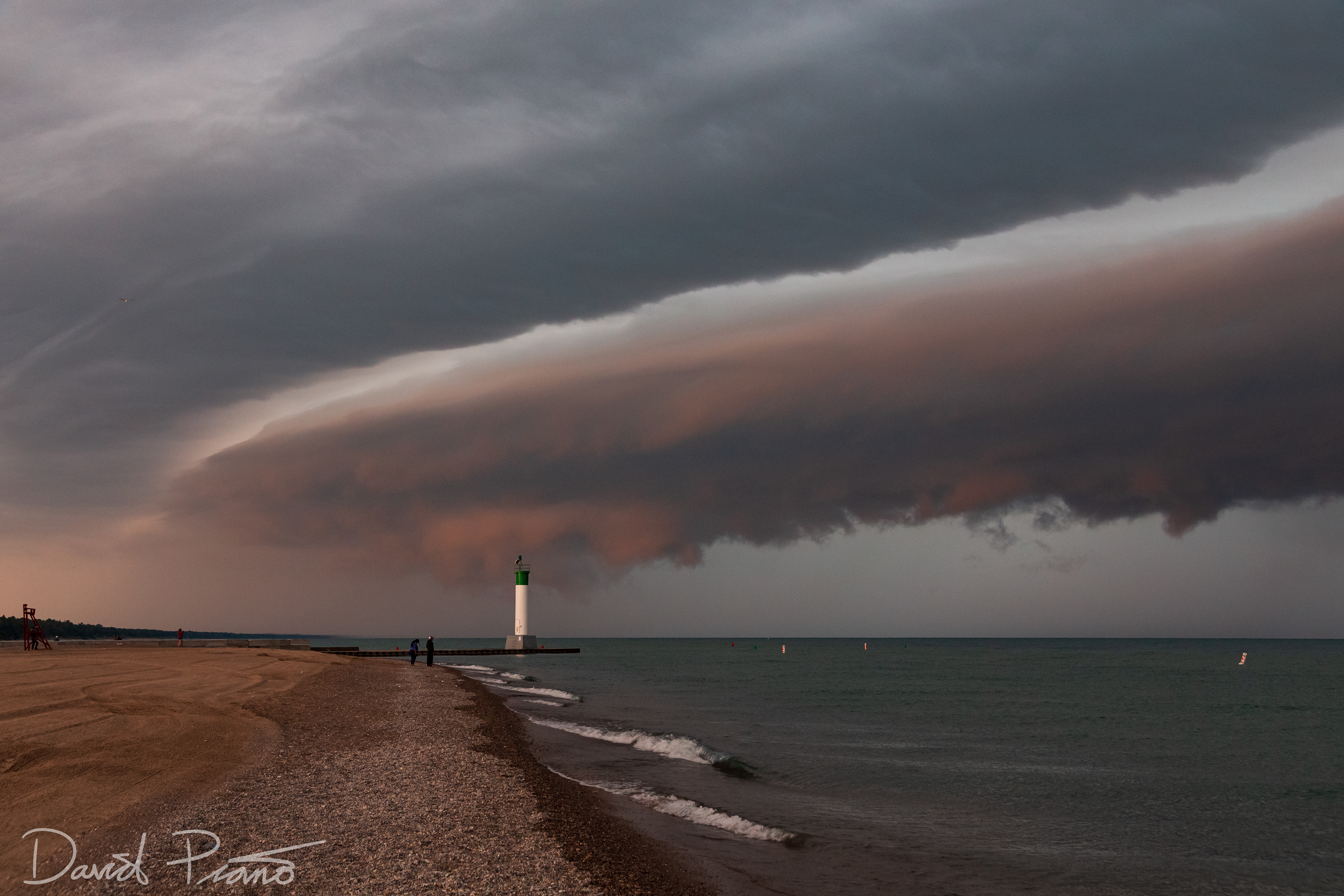 Sunrise-illuminated shelf cloud moving into Grand Bend