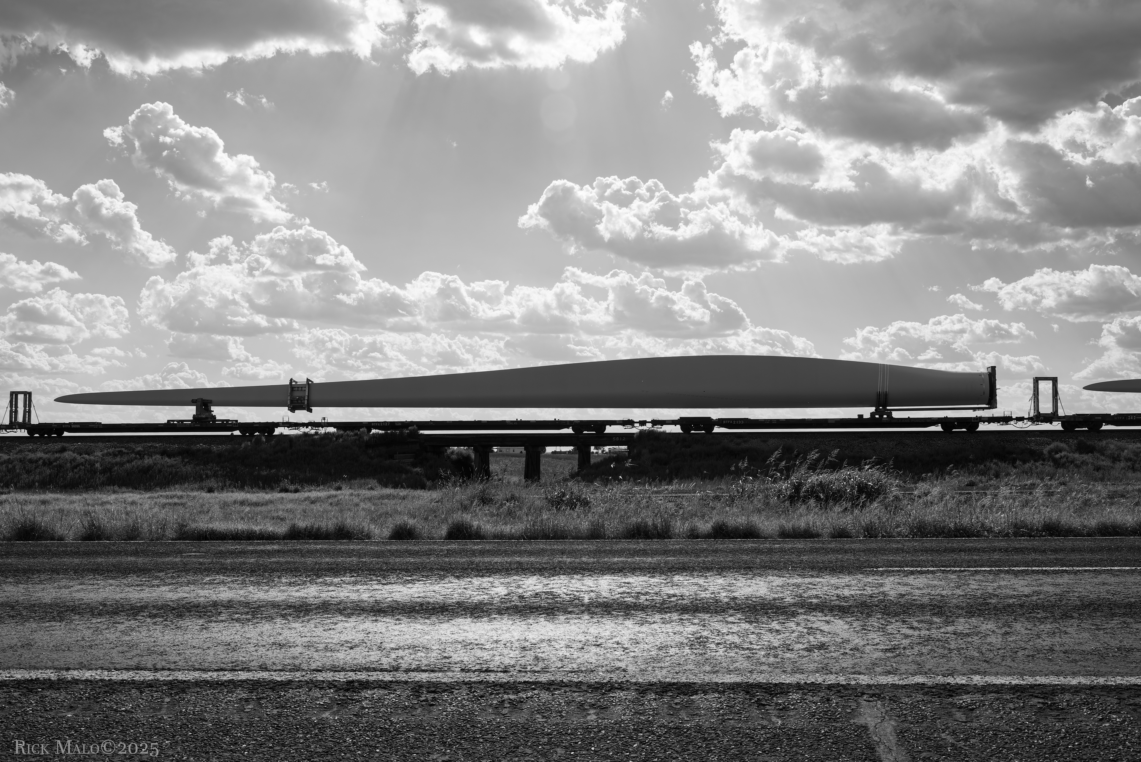 Big blades roll north on the Plainview Subdivision.