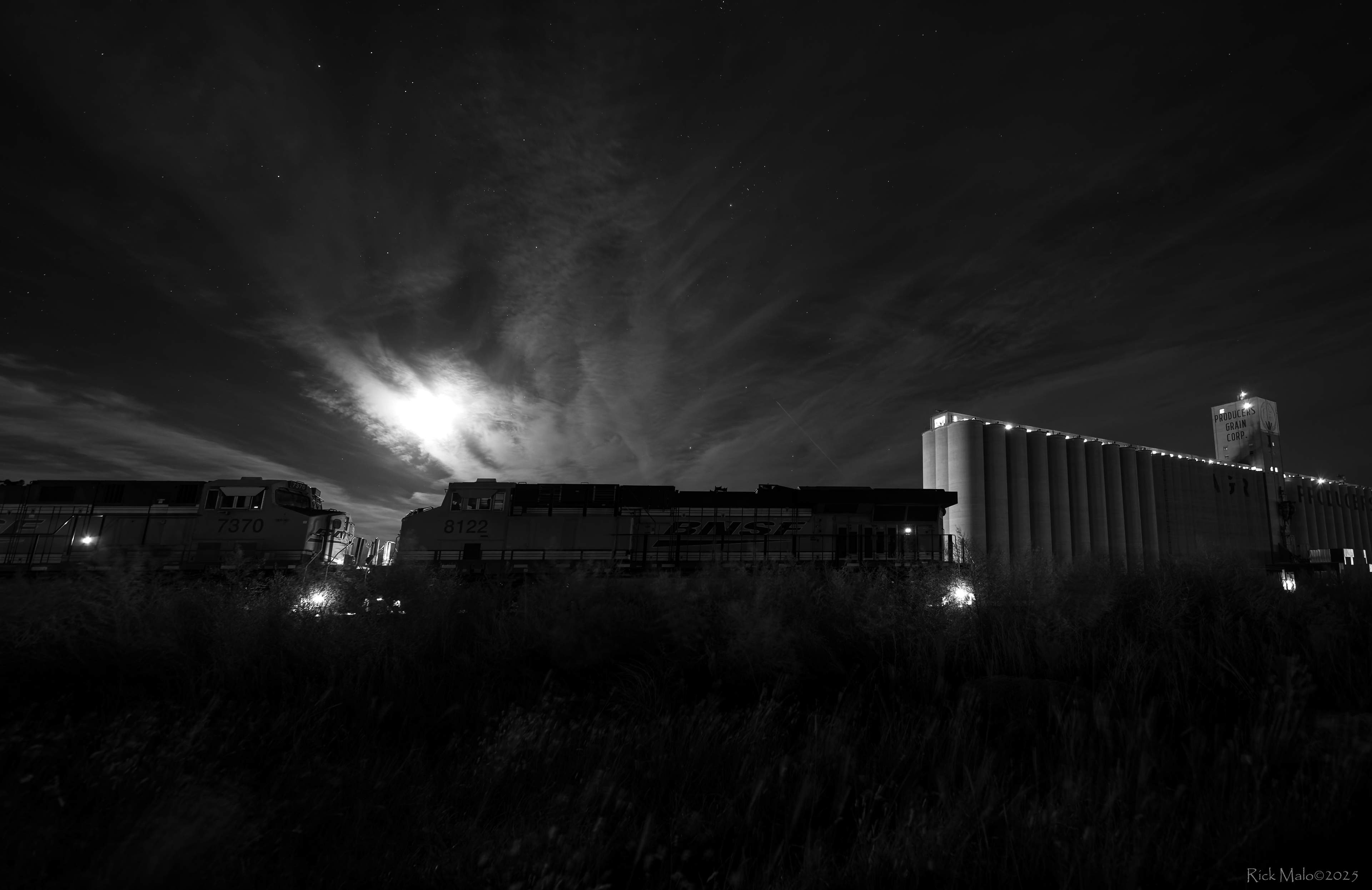 As the November moon rises over Plainview, Texas, the throb of idling GEs fills the air at the Producer's Grain elevator.