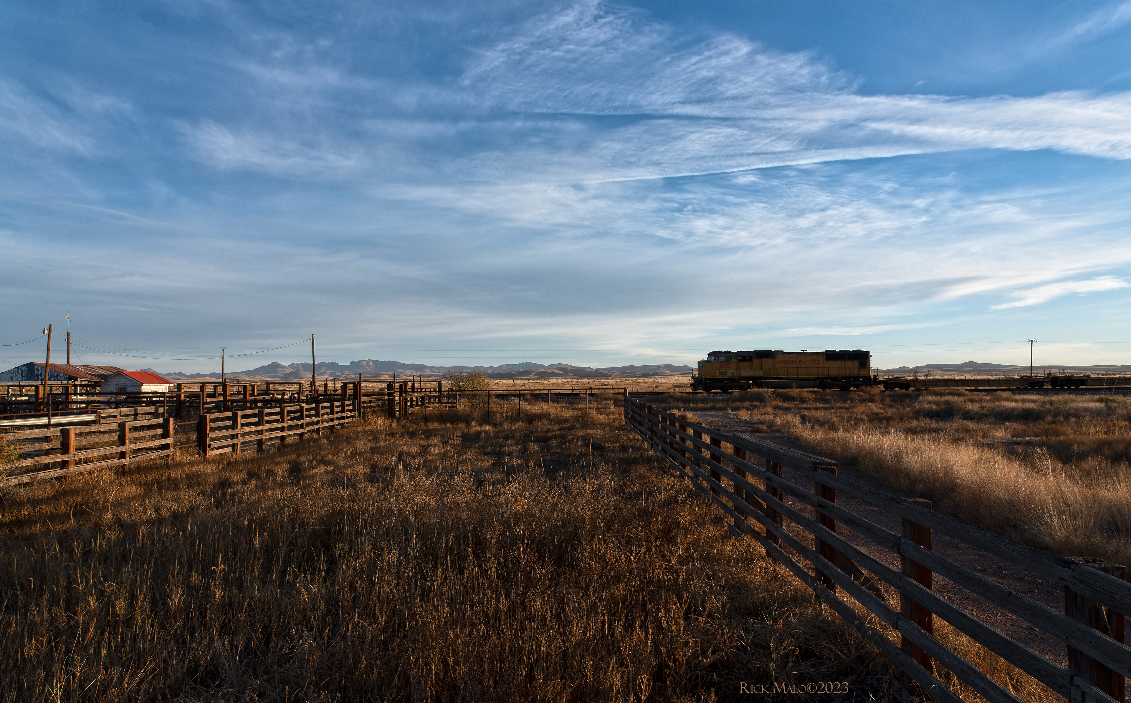 With the Davis Mountains as a backdrop, the lone SD rolls past the old cattle pens at Ryan, Texas. The movie "Giant" with Rock Hudson and Liz Taylor was filmed here in 1955.