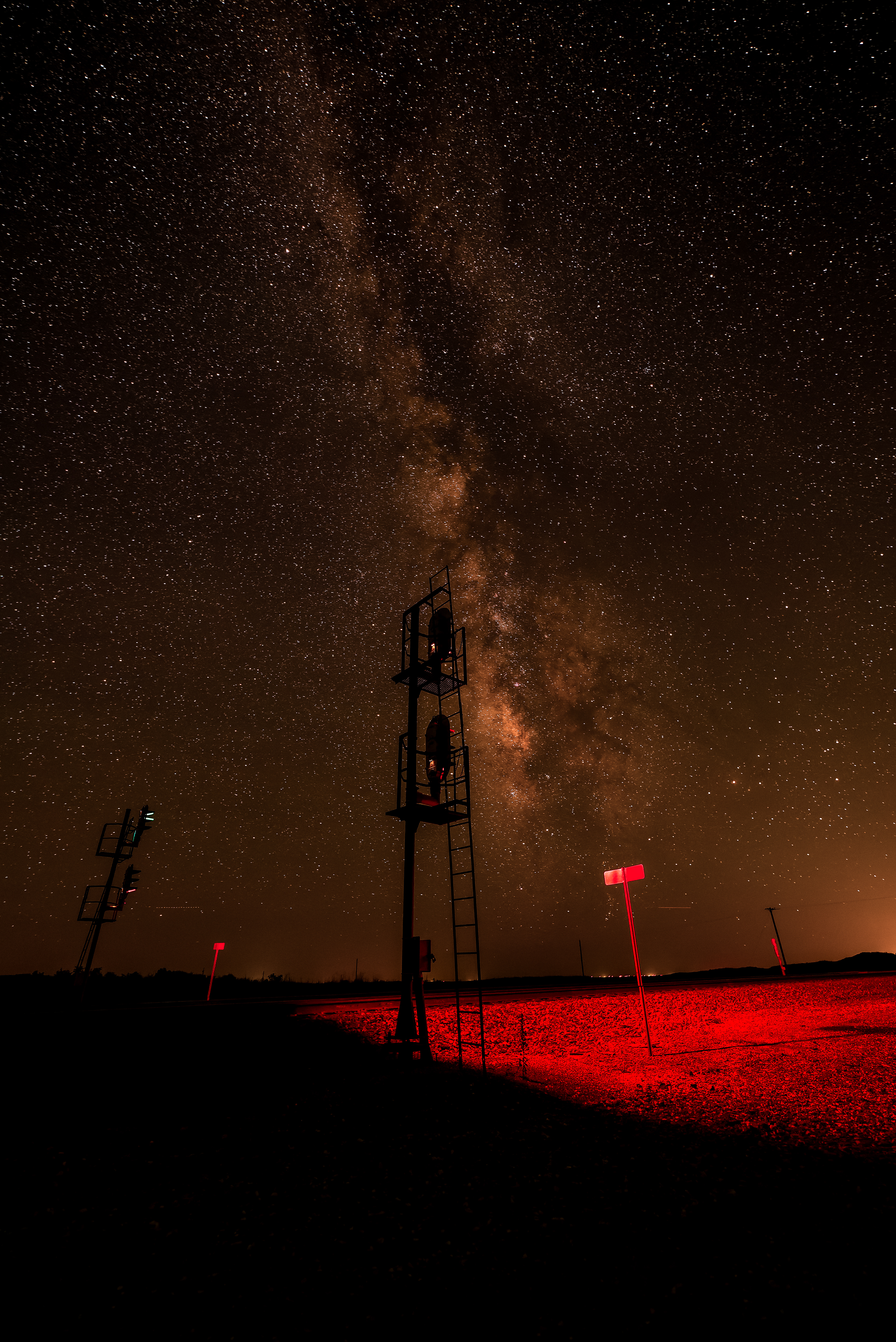 On a summer night on the very edge of Hemphill County, Texas, the Milky Way rises behind the signals at the Coburn Crossovers, 5 miles east of Glazier.