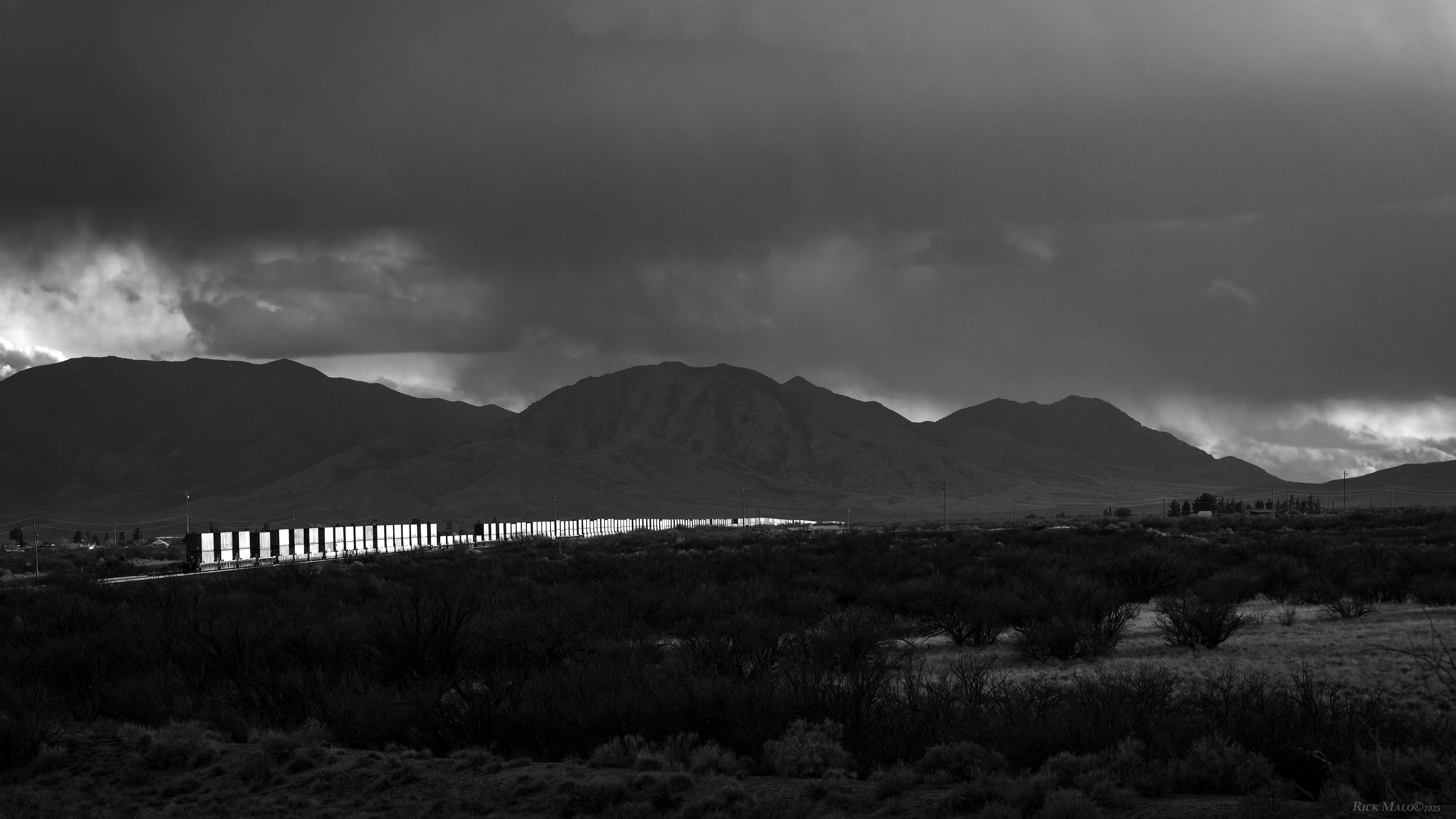 A February sunset sees westbound containers rolling through Cochise, Arizona as the train climbs towards Dragoon Summit on the Sunset Route.