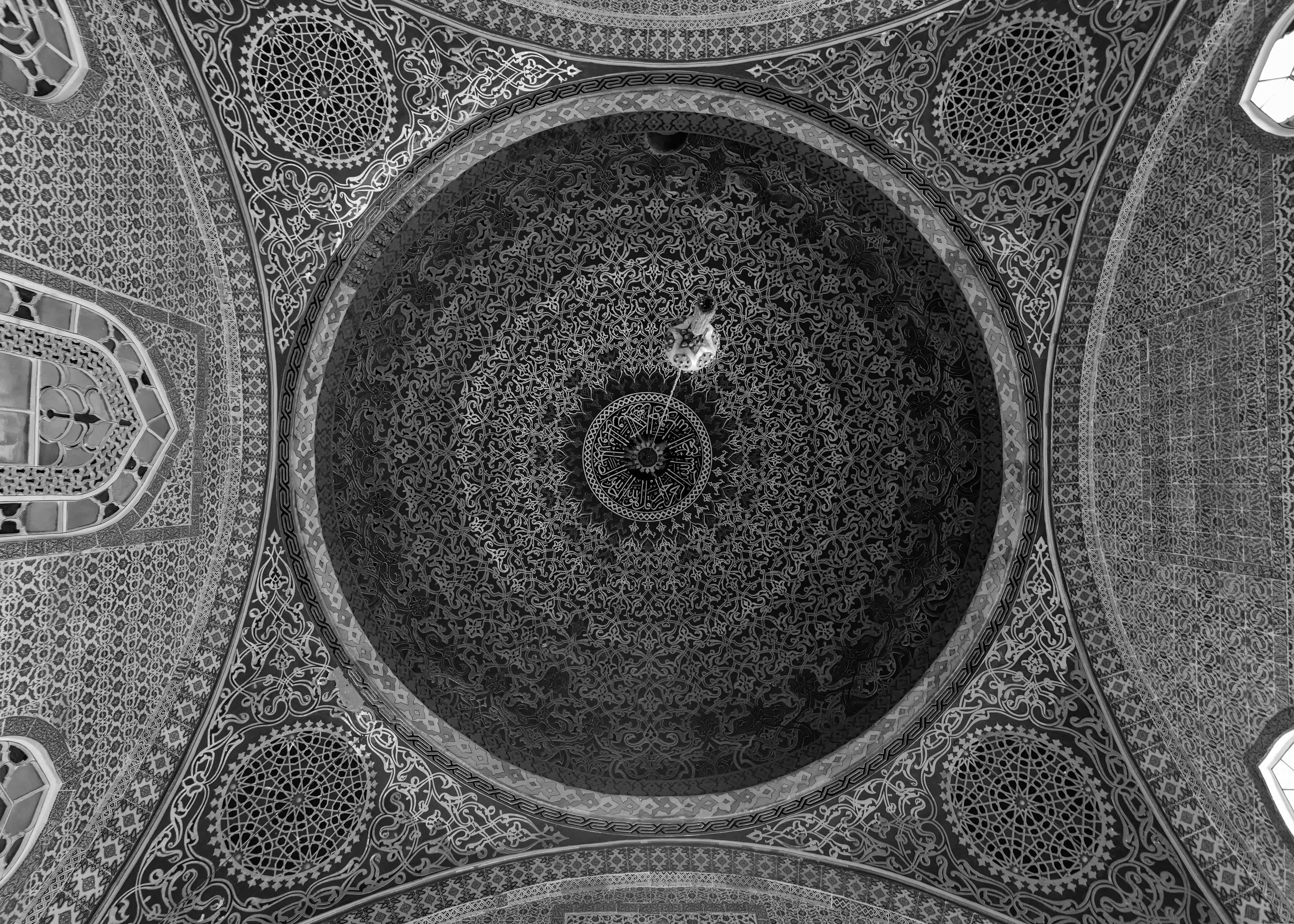 Blue Mosque, straight up into the central dome. More than 200 stained-glass windows were originally set into this space, a diplomatic gift from Venice meant to show off the best glasswork Europe had. Most have since been replaced, over the centuries, with windows that have basically no artistic value by comparison — the light still gets in, it just isn't Venetian anymore.