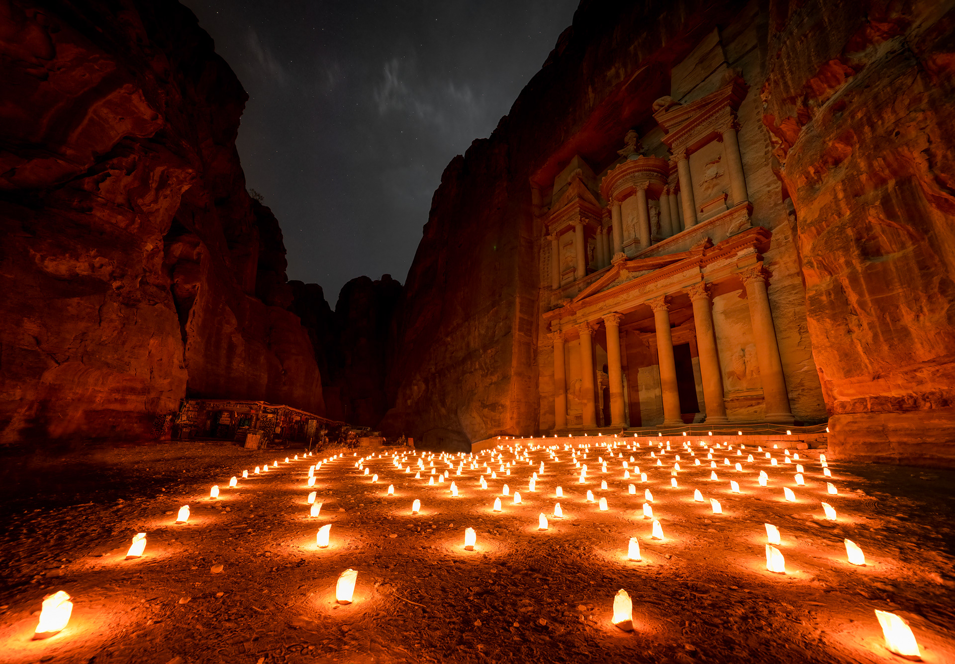 The Treasury by candlelight. Three nights a week, Jordan lights the Siq for tourists. That night the tourism board held the doors, and I had the courtyard to myself — just warm candlelight and weathered stone.