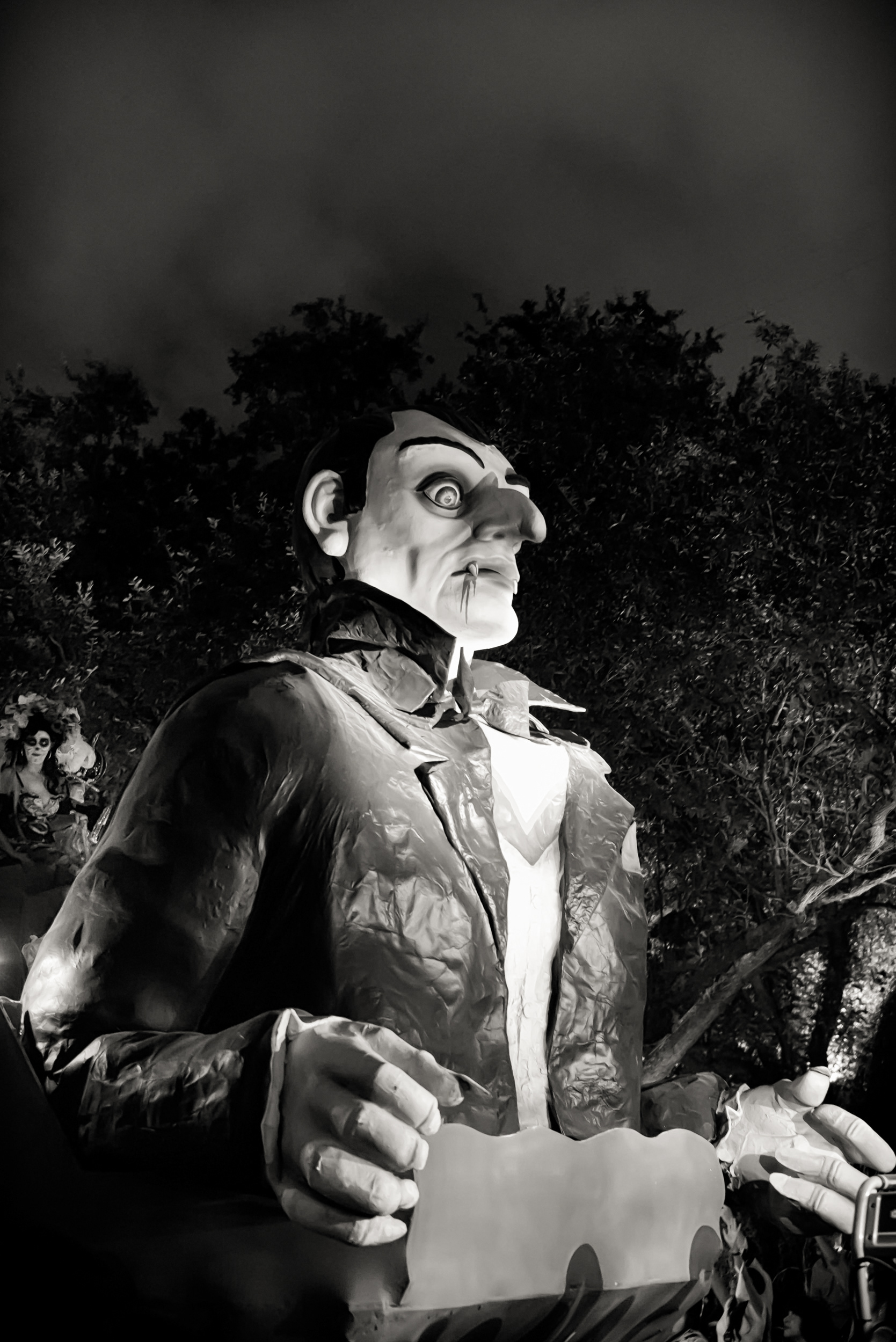 This one looks mounted on a vehicle or some motorized rig rather than carried by a person underneath — an update on a much older New Orleans trick. In 1873, the Mistick Krewe of Comus staged the city's first fabricated Carnival parade using giant papier-mâché figures, some twelve feet tall, walked by krewe members inside them. Same basic idea, different engine.