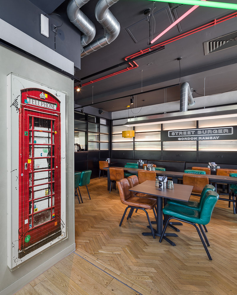 Artworks behind glass by Piers Bourke at Gordon Ramsay Restaurant, London