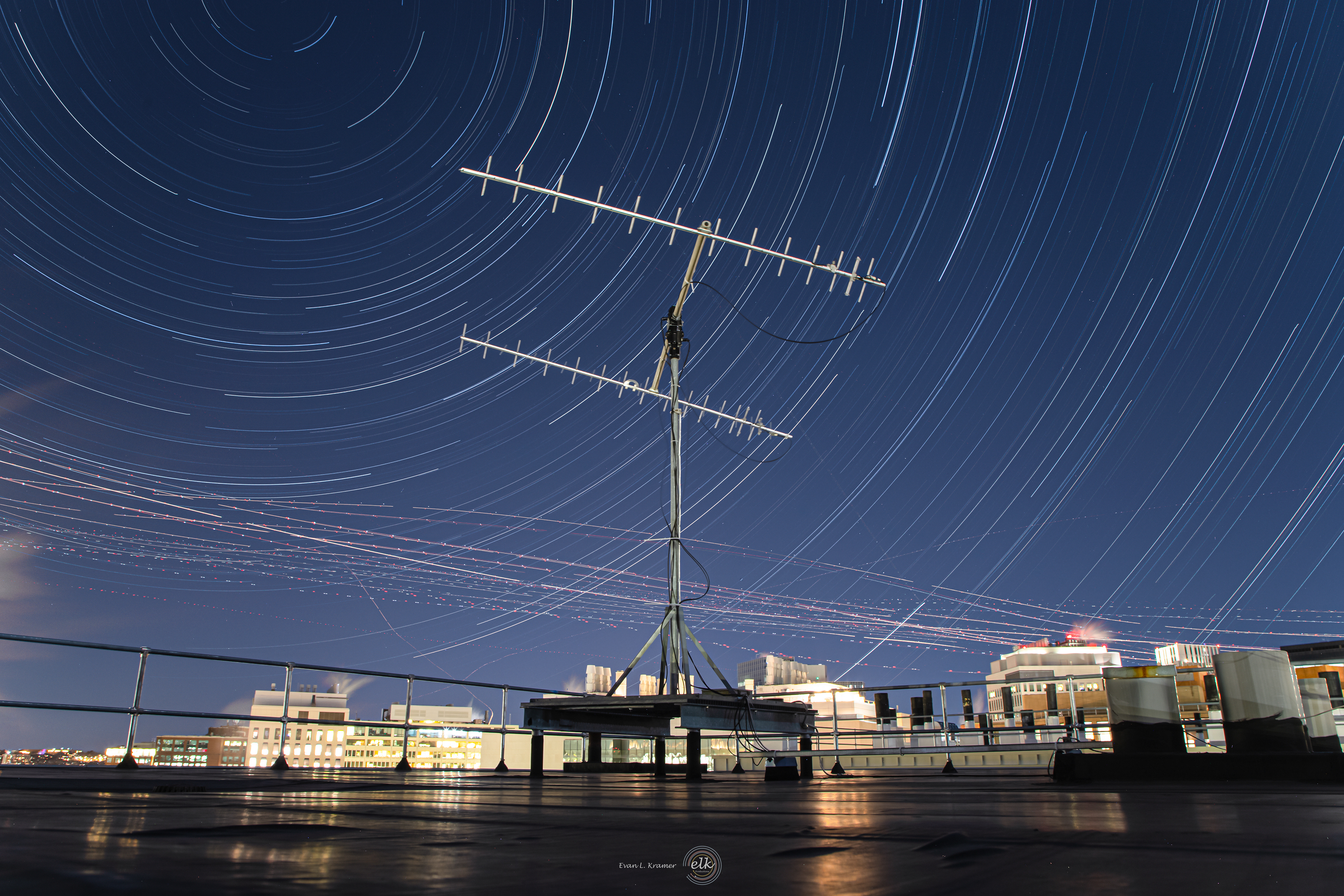 Star trails, air traffic from Logan airport, and the radio antenna on top of the McNair building. Cambridge, MA.