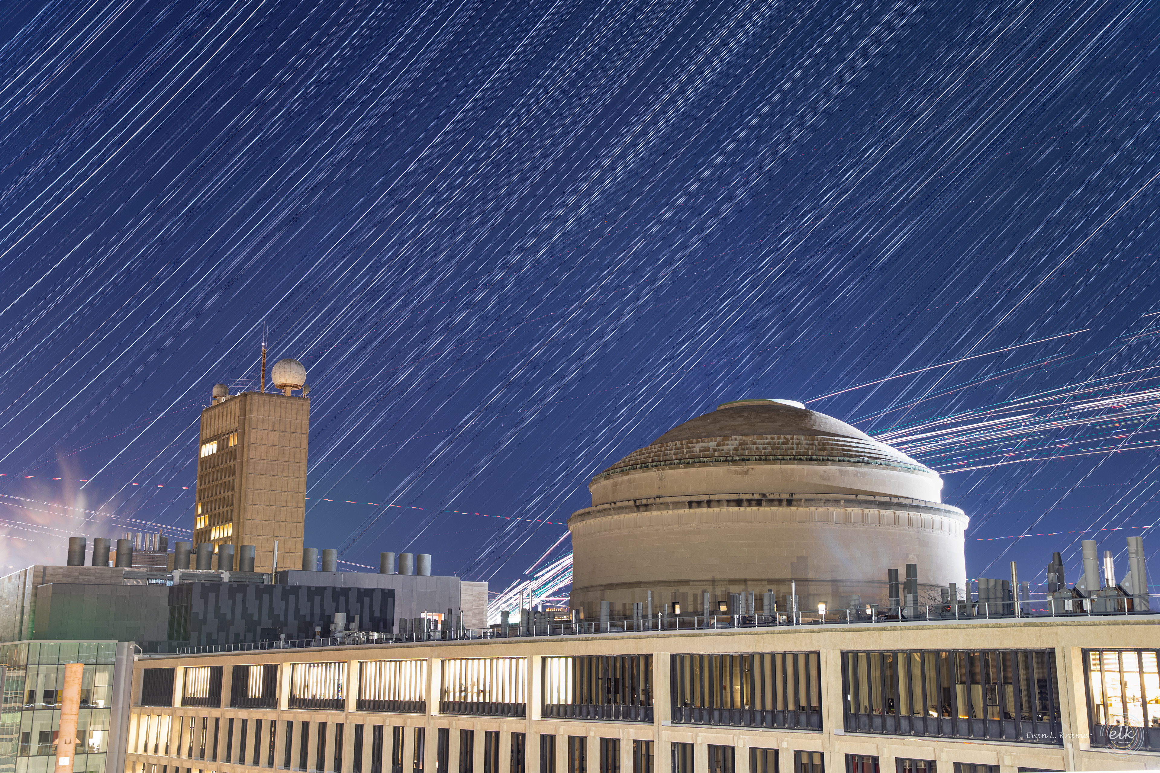 The MIT Dome and Green building with star trails and air traffic from Logan airport. Cambridge, MA.