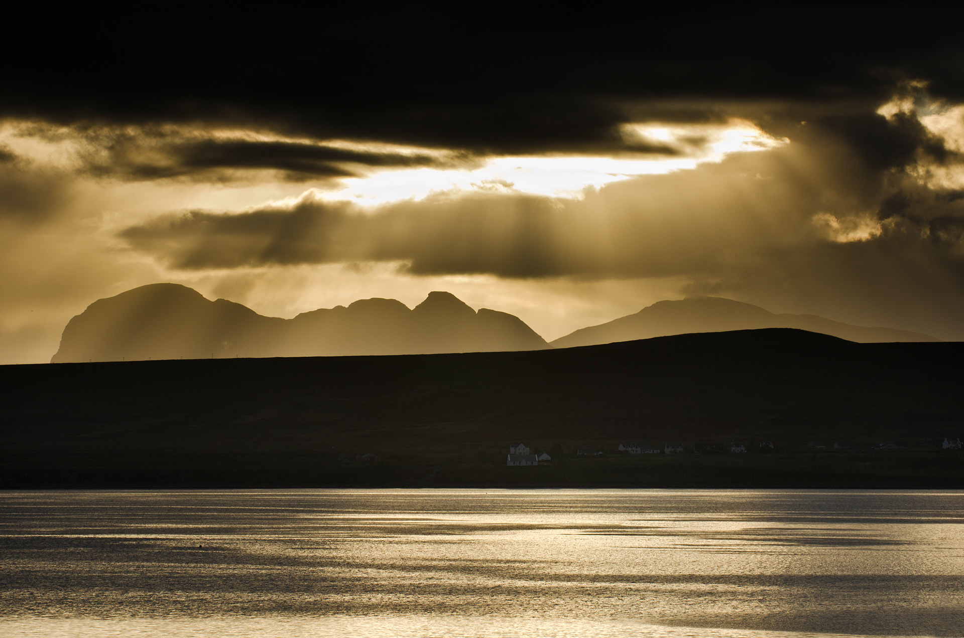 Storm sunlight over Suilven and Canisp