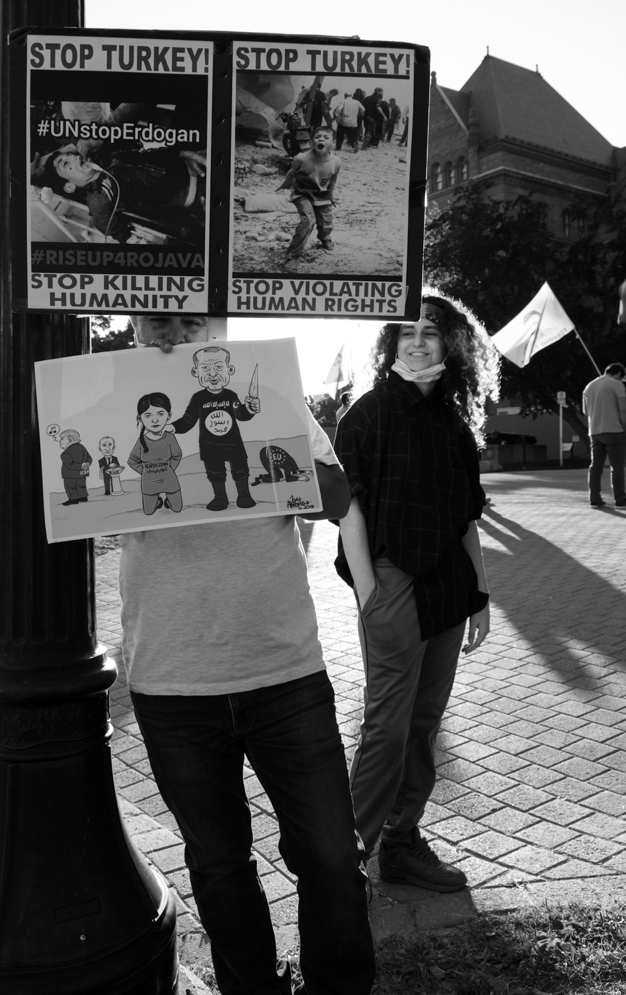 A Kurdish group protesting their genocide by Turkish government, outside the Ontario assembly in Toronto. This man was kind to talk to me with his daughter looking at him proudly.
