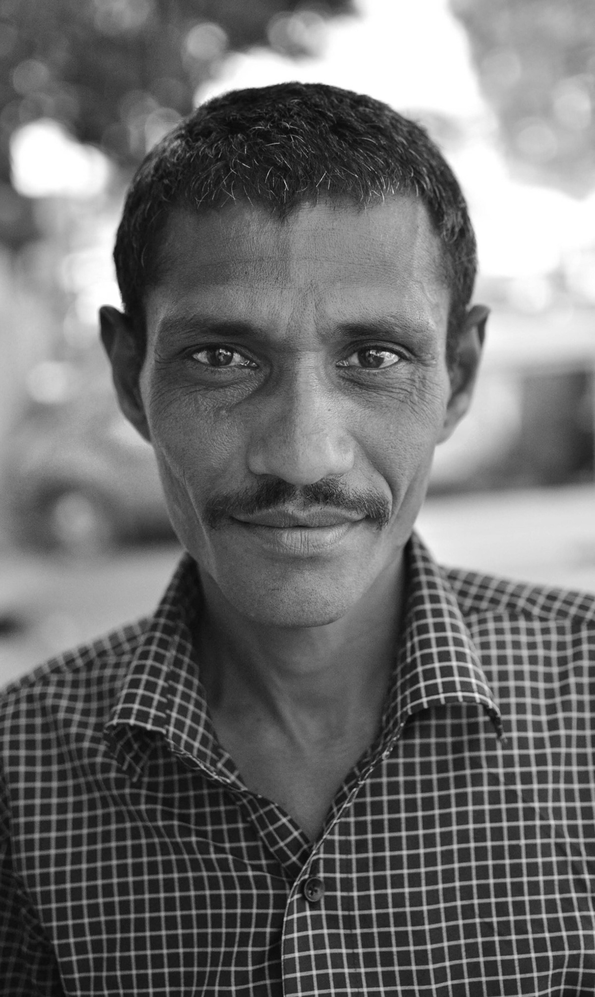 A street vendor in the city of Udaipur, India. Street vendors in India work in back-breaking, scorching heat. Udaipur is a city in the great state of Rajasthan which can get very hot in the summers.
