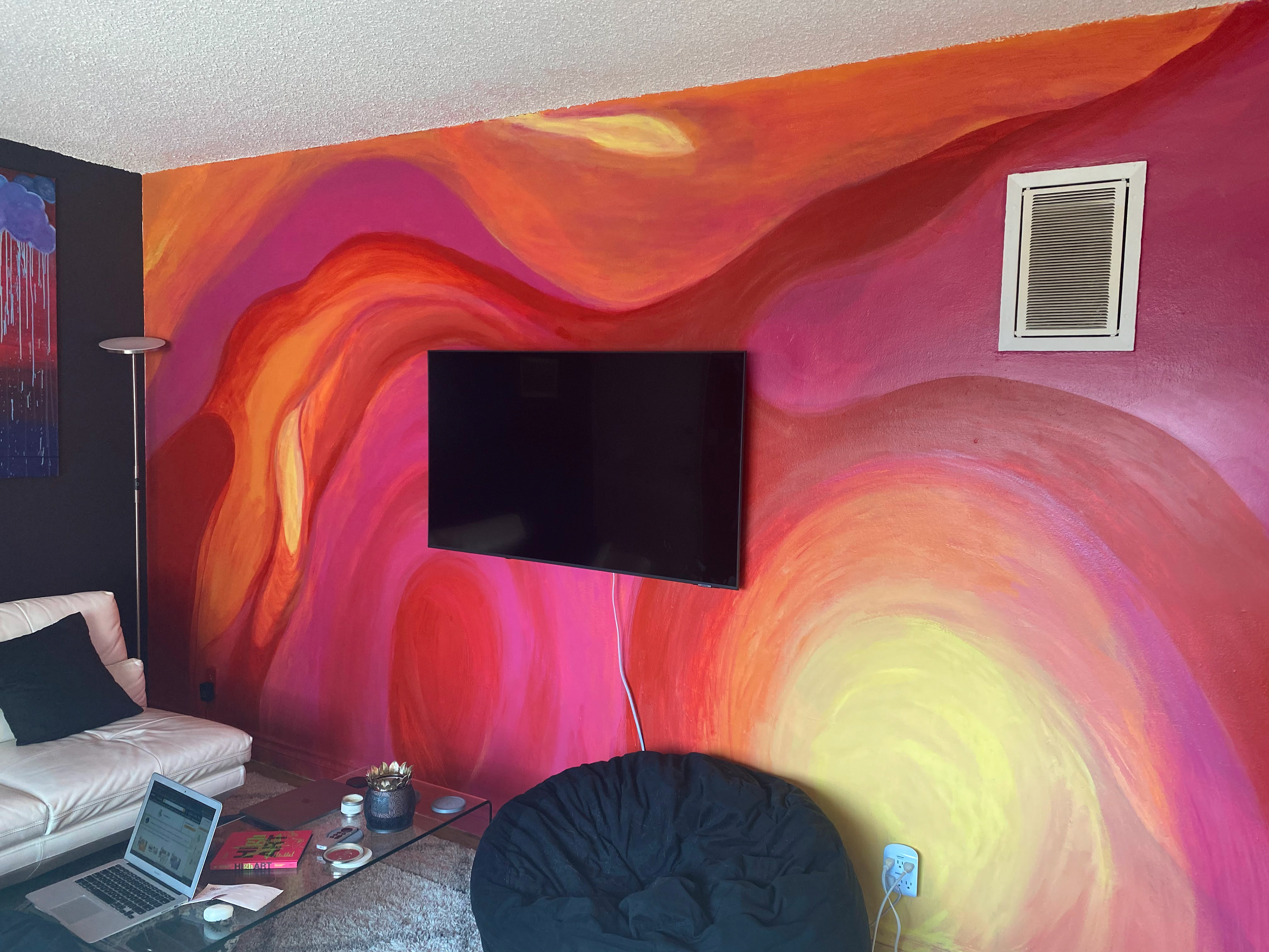 The mural/accent wall I painted inspired by a psychedelic sunset