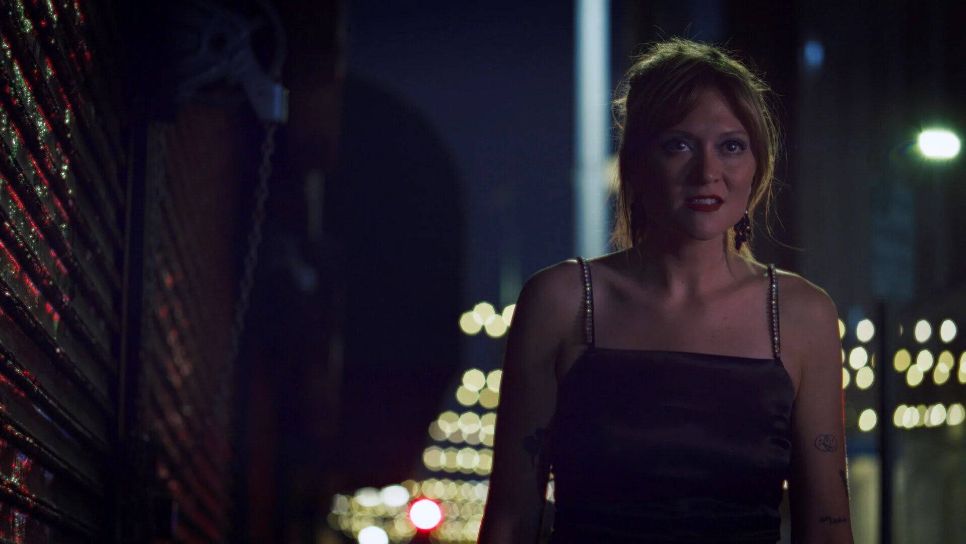 While Celeste's spy wardrobe is all black, her eyeshadow is blue.