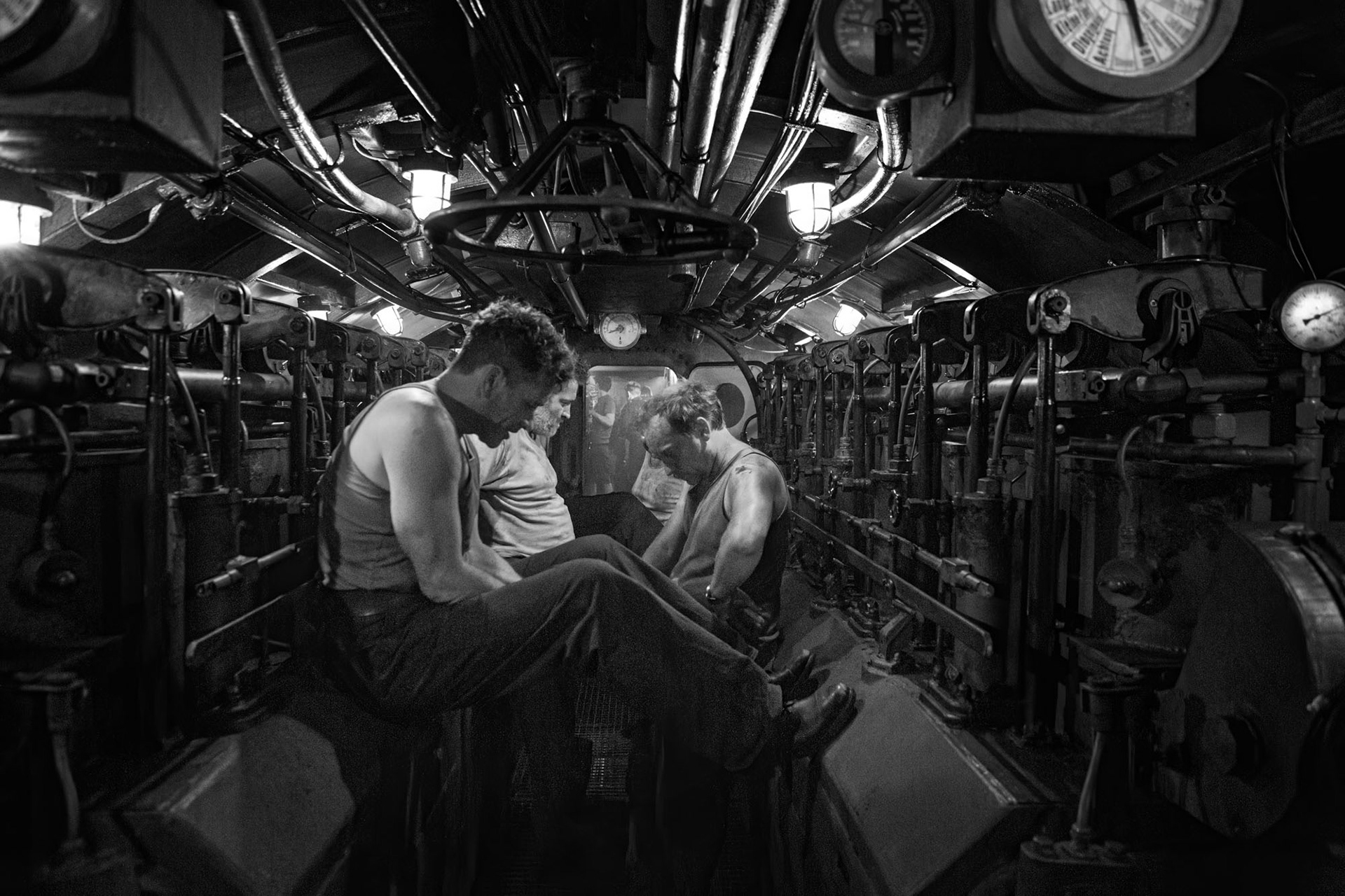 Actors preparing for scene in the submarine machine room.
