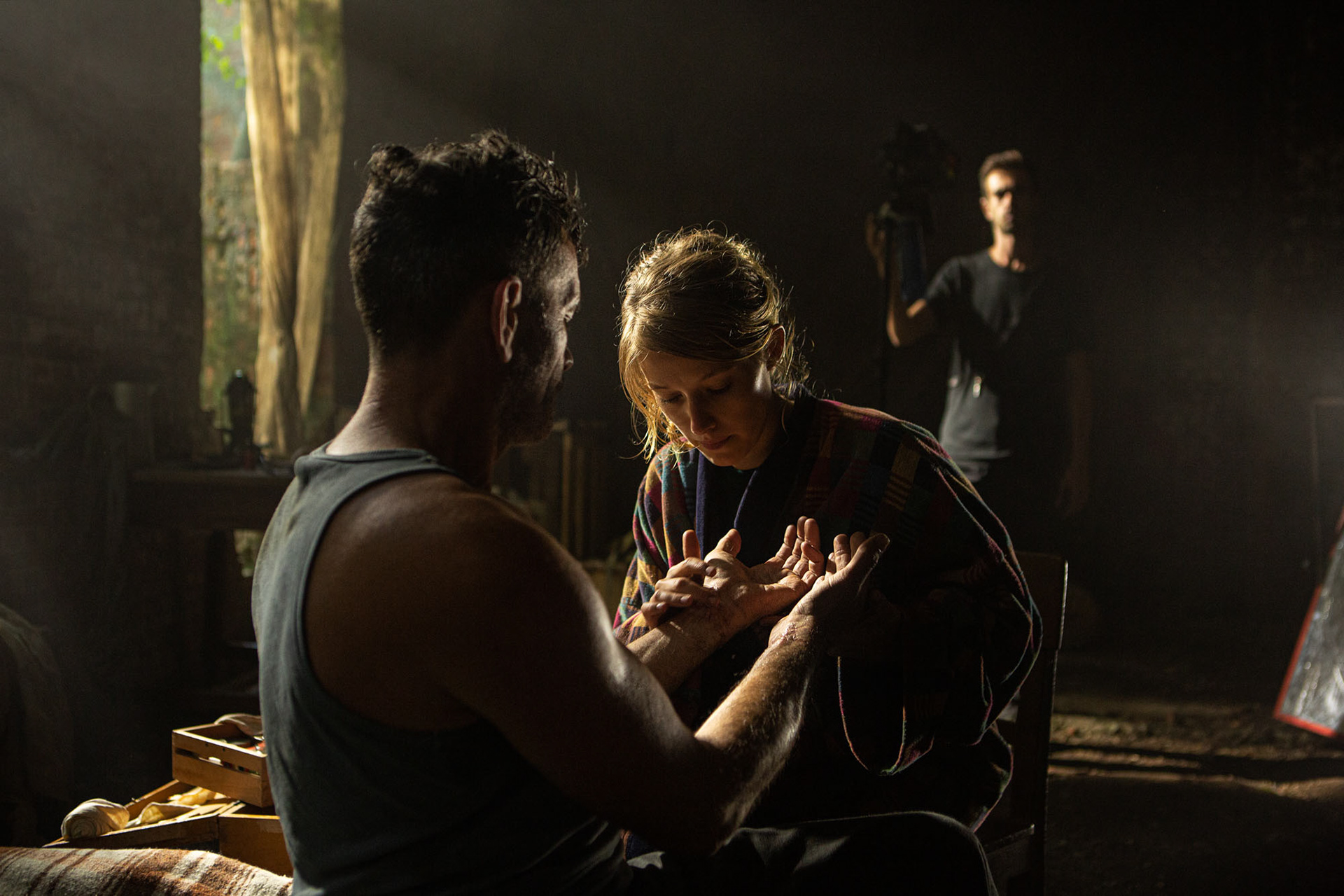 Koen De Bouw and Ella June Henrard rehearsing a scene with the focus puller in the background.