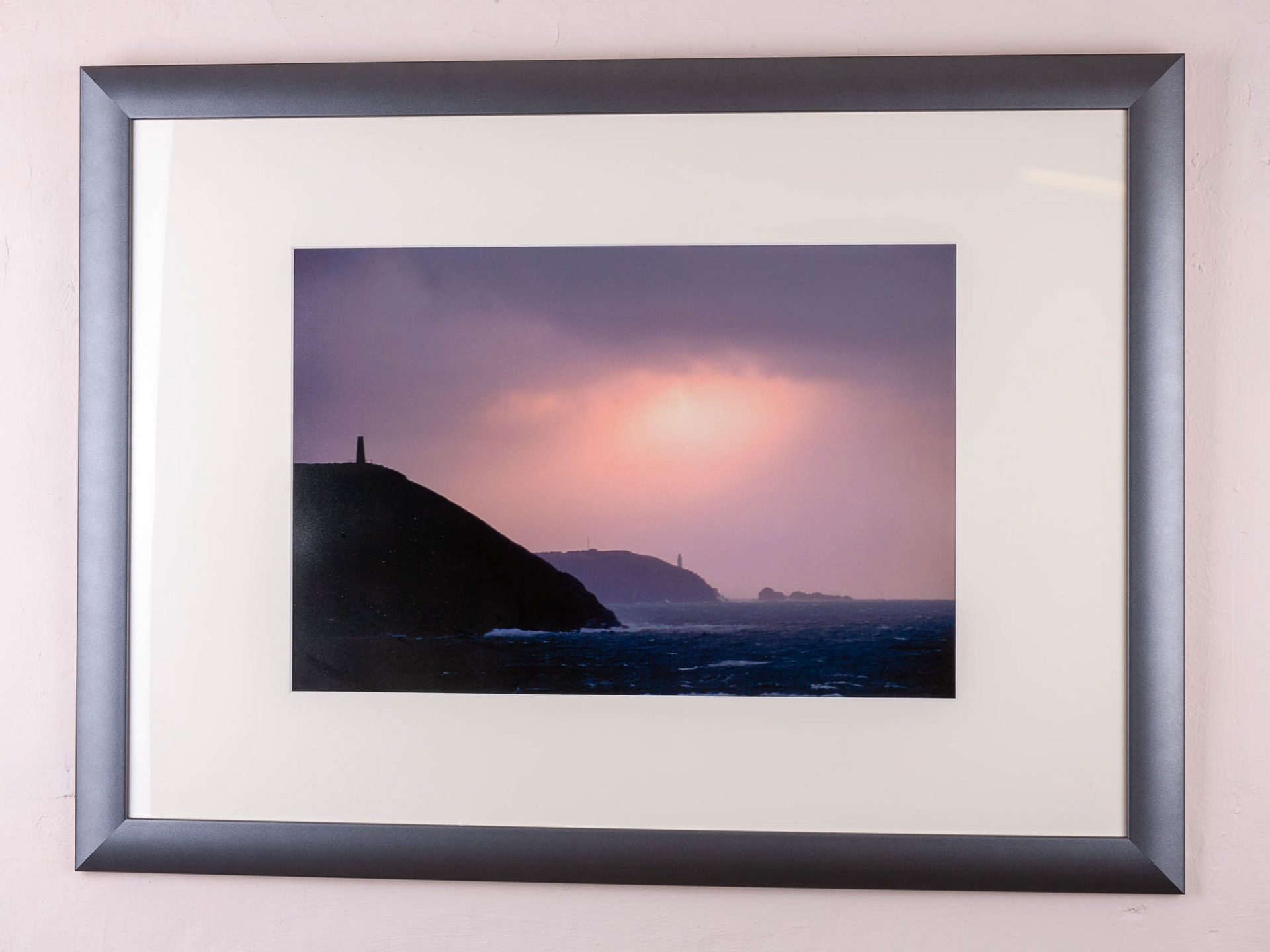 STEPPER POINT SUNSET STORM. An original photograph by Chris Rose. Image size: 31cm x 46cm. Frame size: 56cm x 77cm. FOR SALE £85