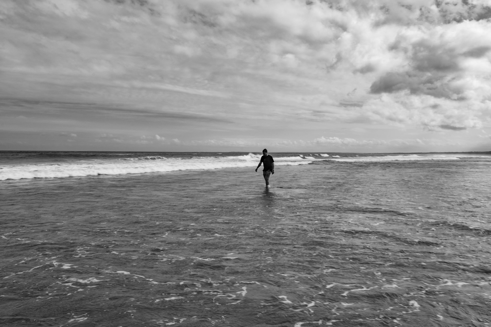 Person paddling at Seven Mile Beach