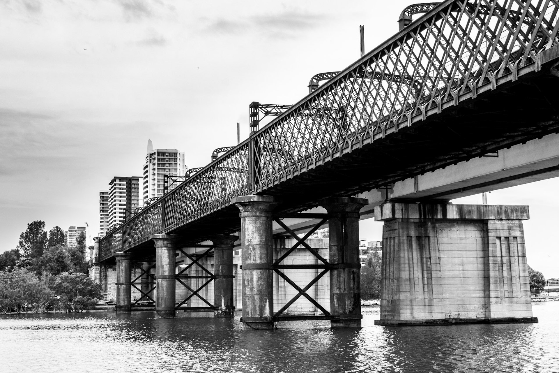 Rustic train bridge over river