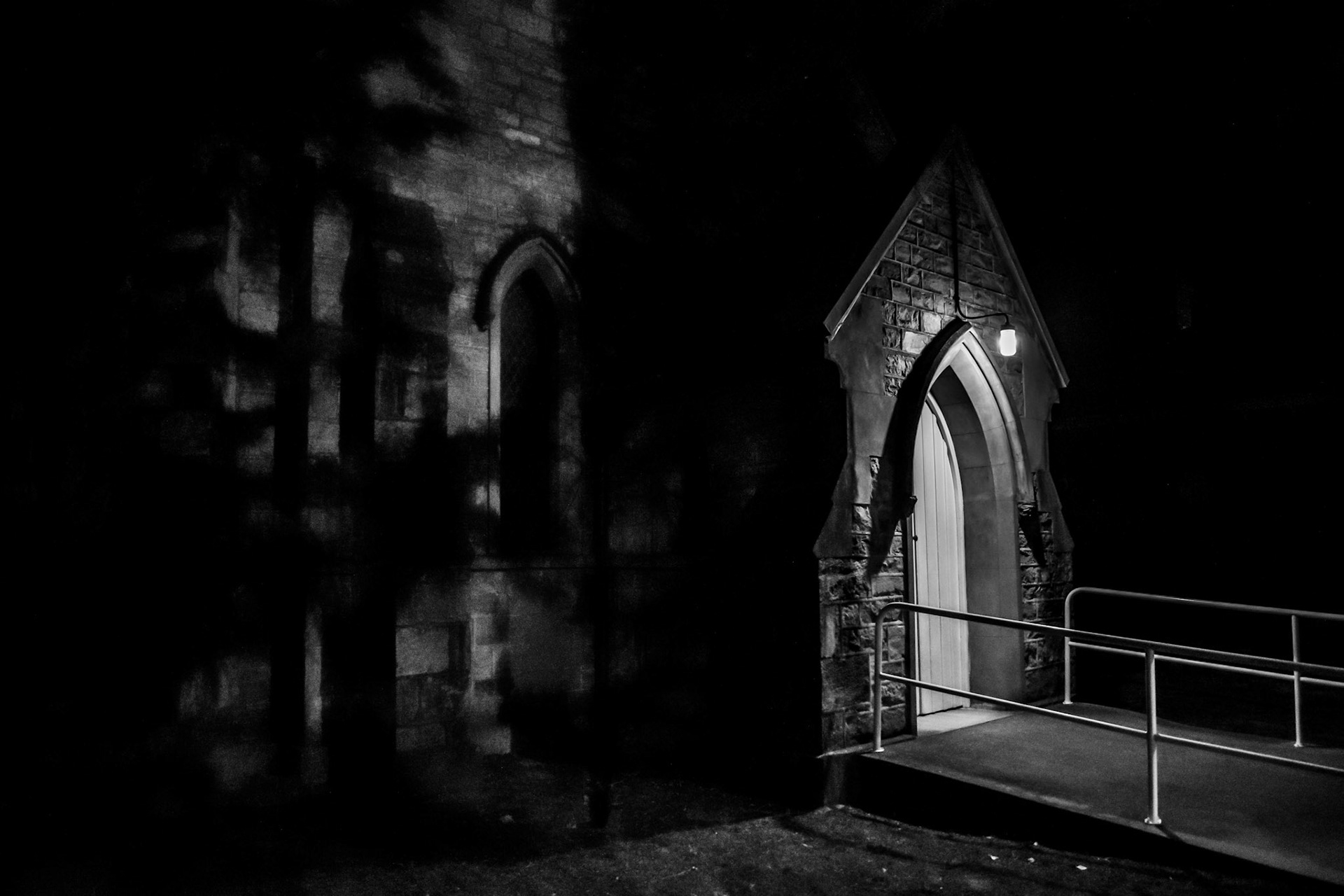 Black and white church at night