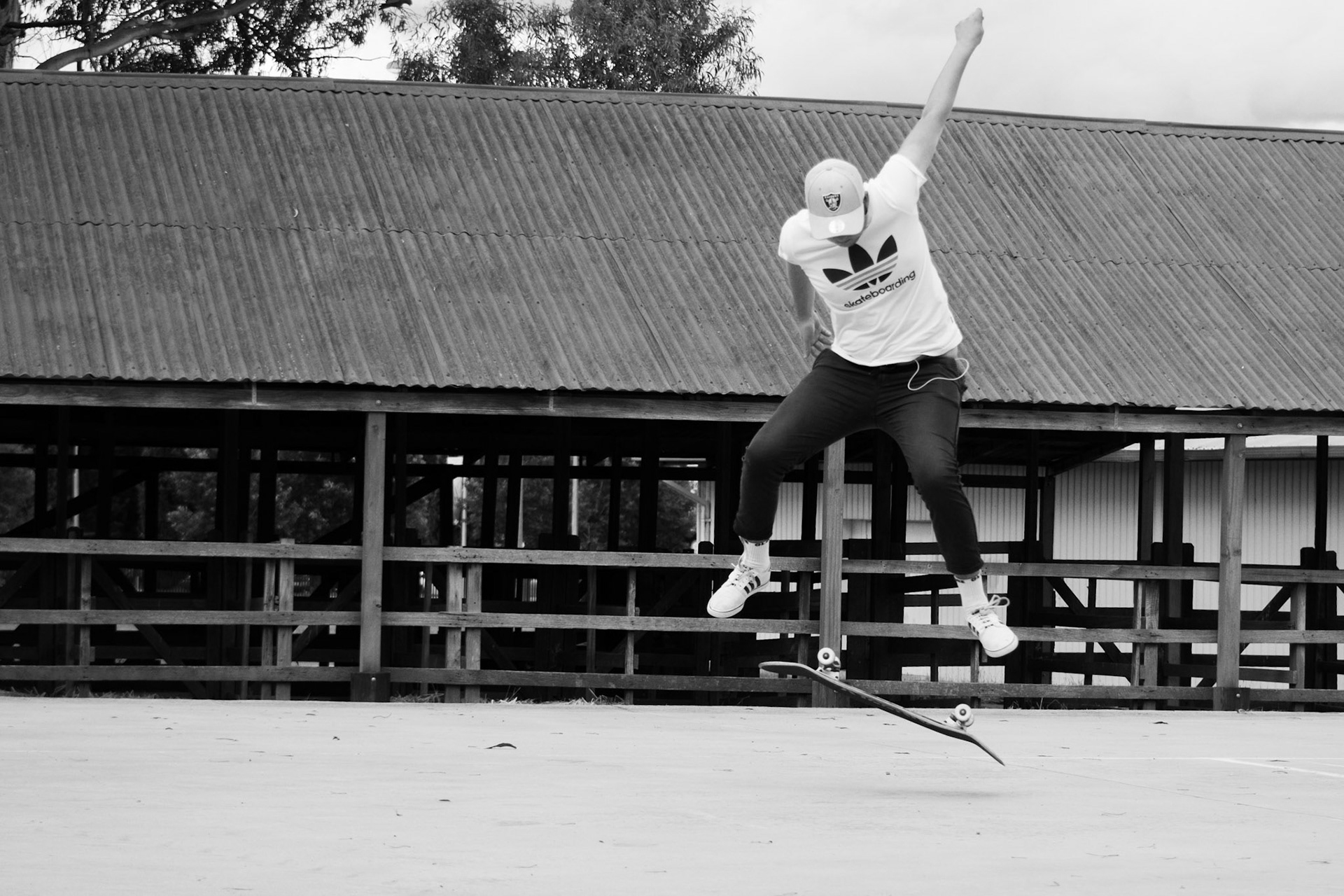 Skater in progress of landing kickflip
