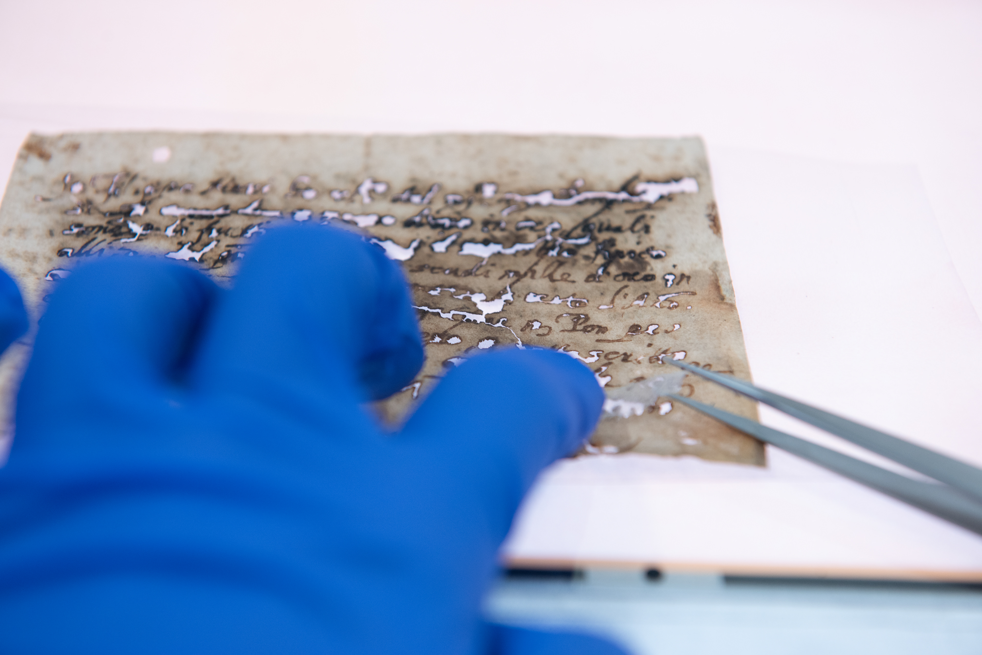 Consolidation and repairs of damaged paper object. Example of IGI corrosion of manuscript. © Wyszomirska-Noga