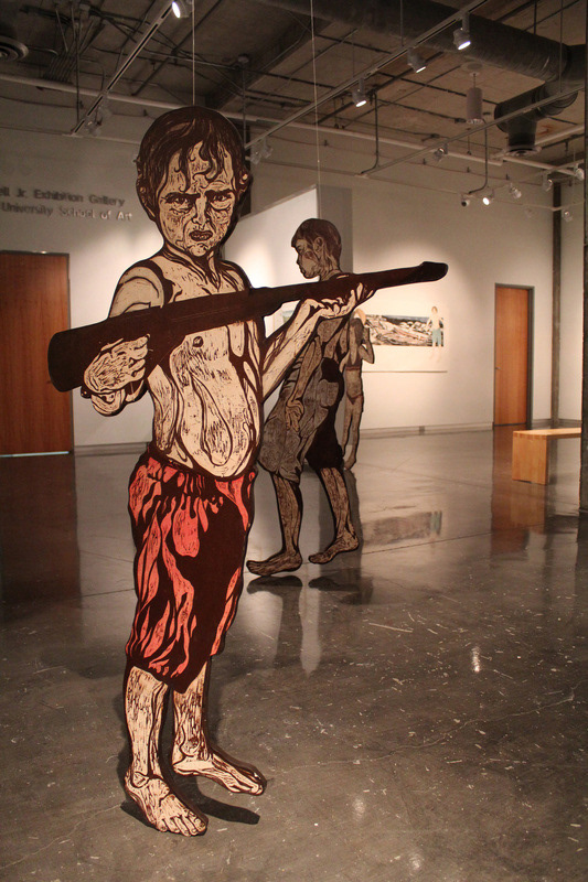Up Like Weed (installation view) 2012, figures are relief print collaged on woodcut matrix, approx. 60in x 36in each