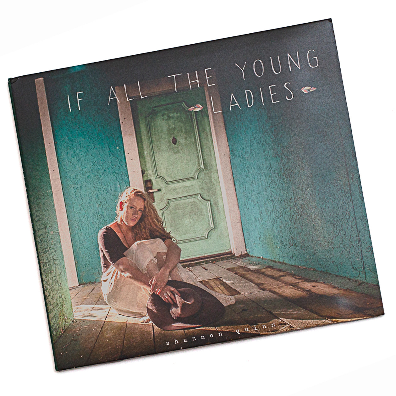 Shannon Quinn's "If All the Young Ladies." Shannon and I had a brilliant time shooting at a shuttered vacation resort, which offered a wonderfully colorful and overgrown setting for her photographs. The pattern in the lyric book is taken from some vintage wallpaper I photographed at a historic home in Ohio several years earlier.