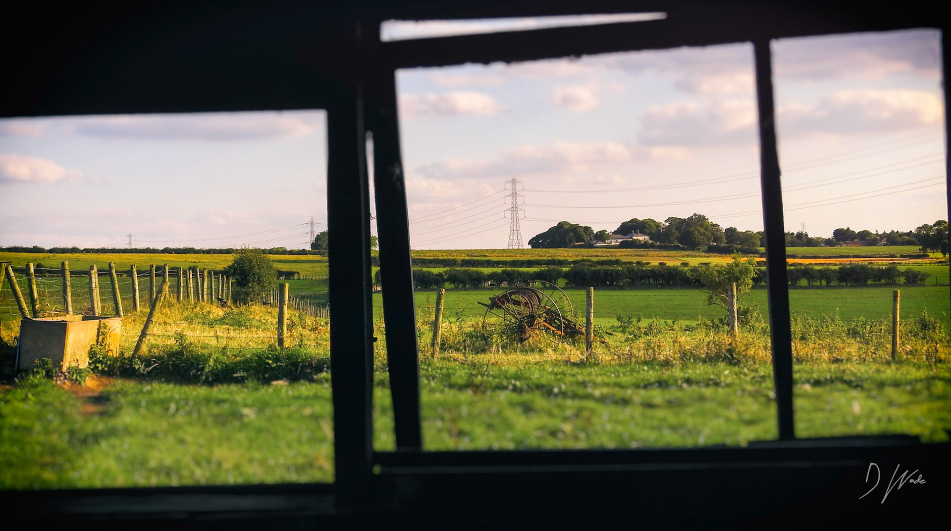 Looking through the derelict barn windows into the distant fields of County Durham.