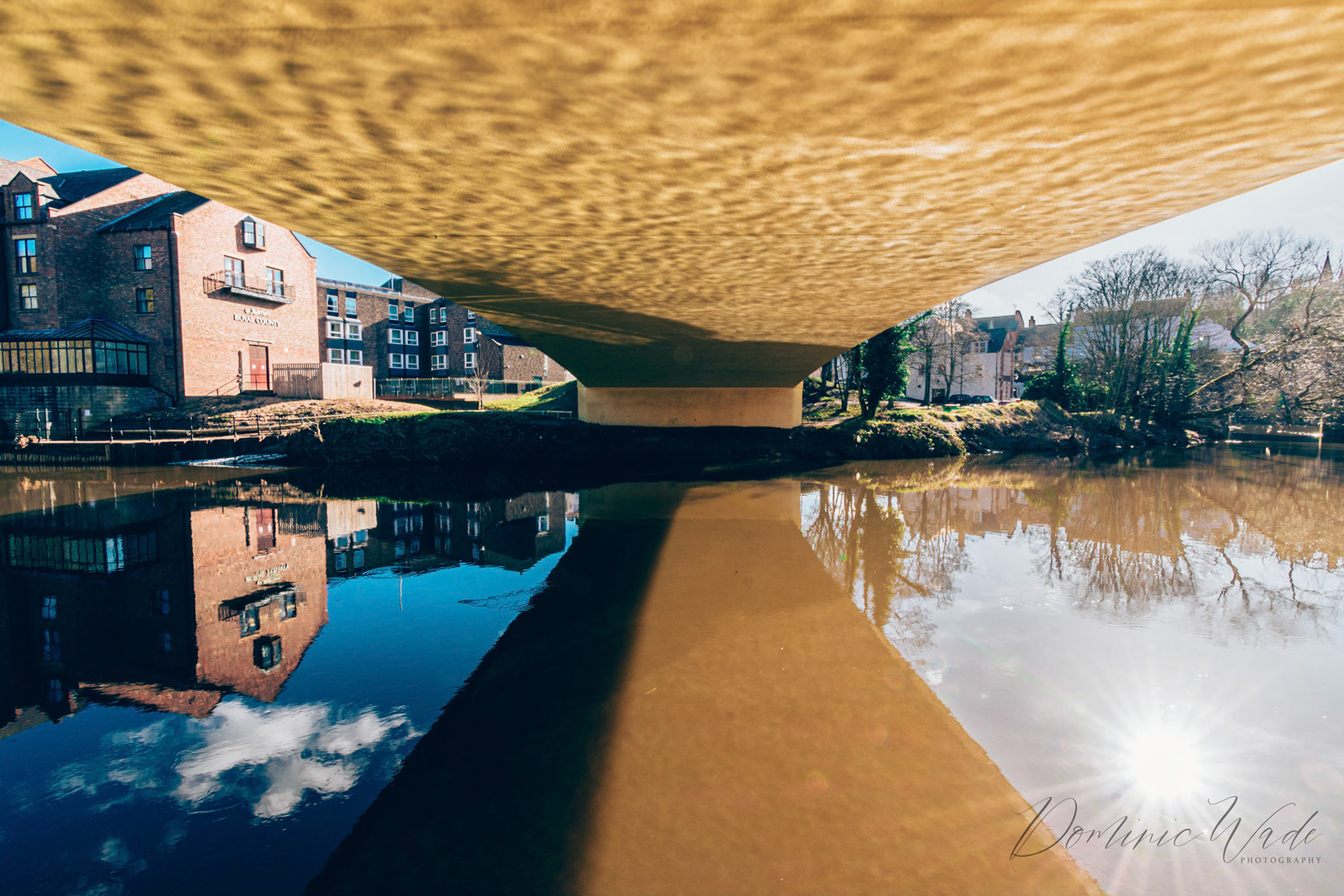 Underneath the recently restored New Elvet Bridge. I love the water being reflected off the underside of the bridge and the sun being reflected in the water.
