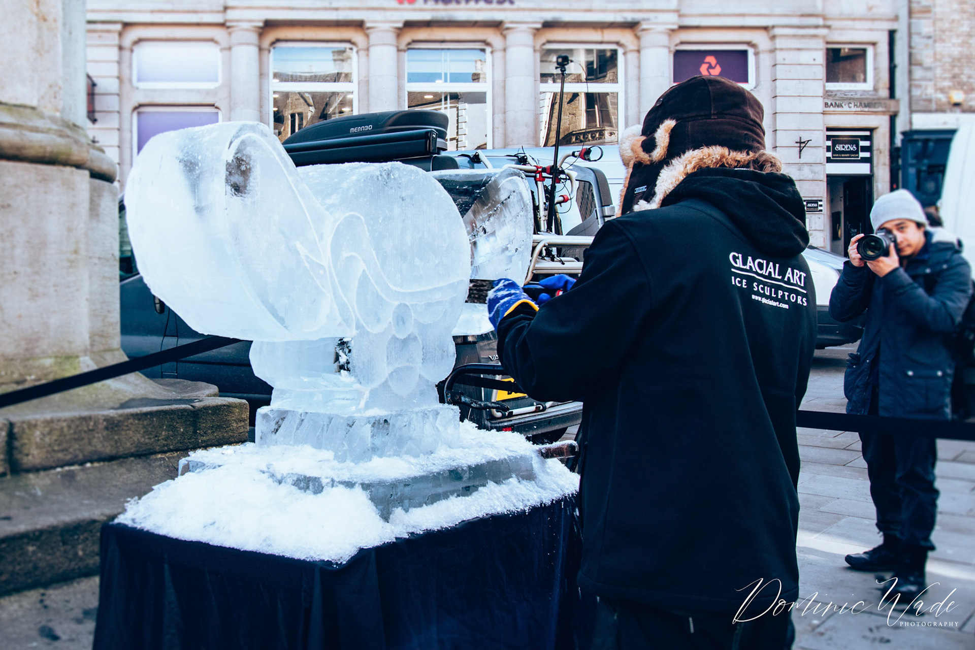 An ice sculptor refining his work. Part of the Fire and Ice festival in Durham City.