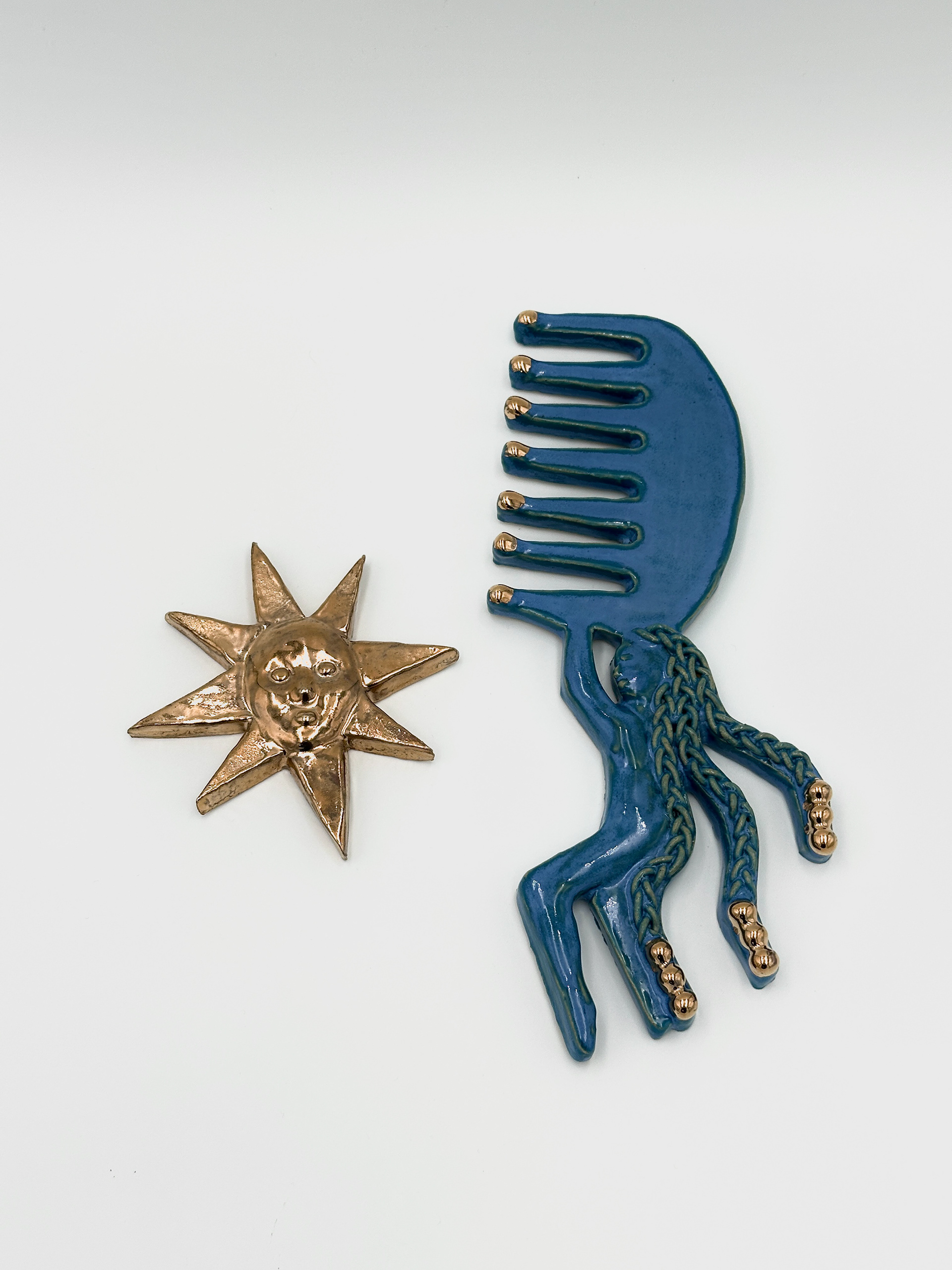 Star Catcher II,  (2025)  9.5 x 3 x .5 inches Ceramics, Gold Luster