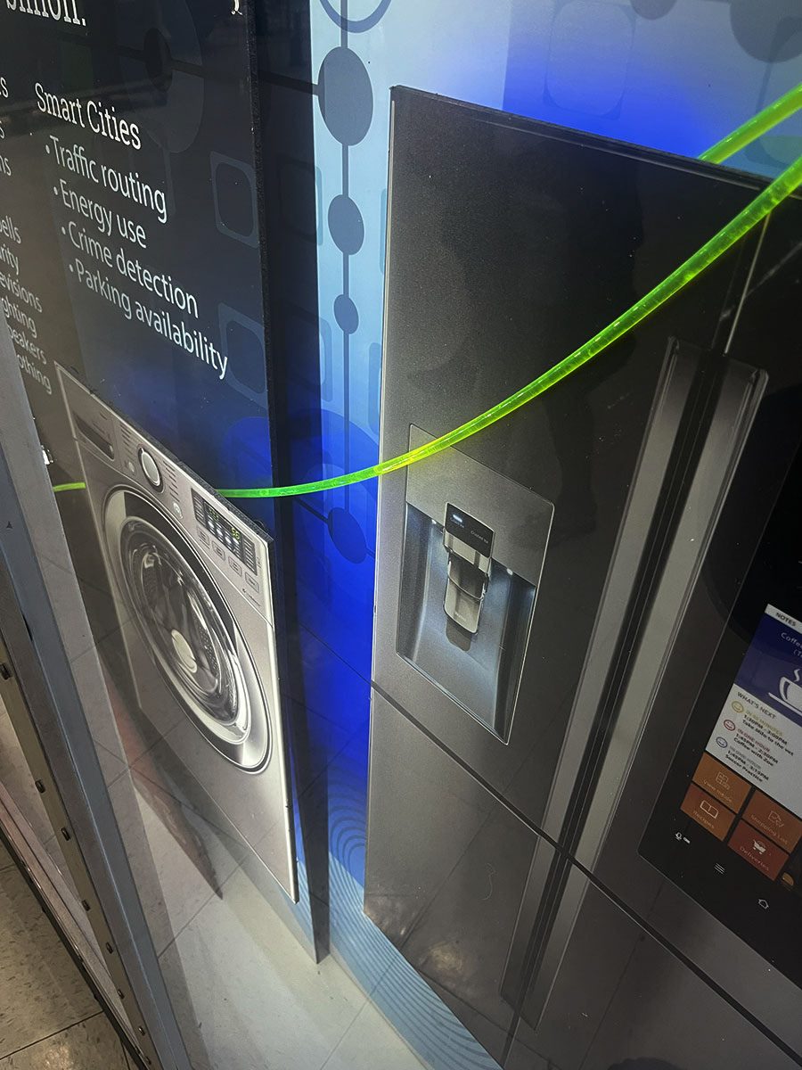 The Coke machine and phone were contour cut on ARC Document Solution’s CNC table from my Photoshop and Illustrator files.   •    Vinyl installation would have jeopardized the deadline, so I had the back and side panels printed on white 1/4” gator, sized for the existing cabinet. I was able to hide all the wiring behind them.  