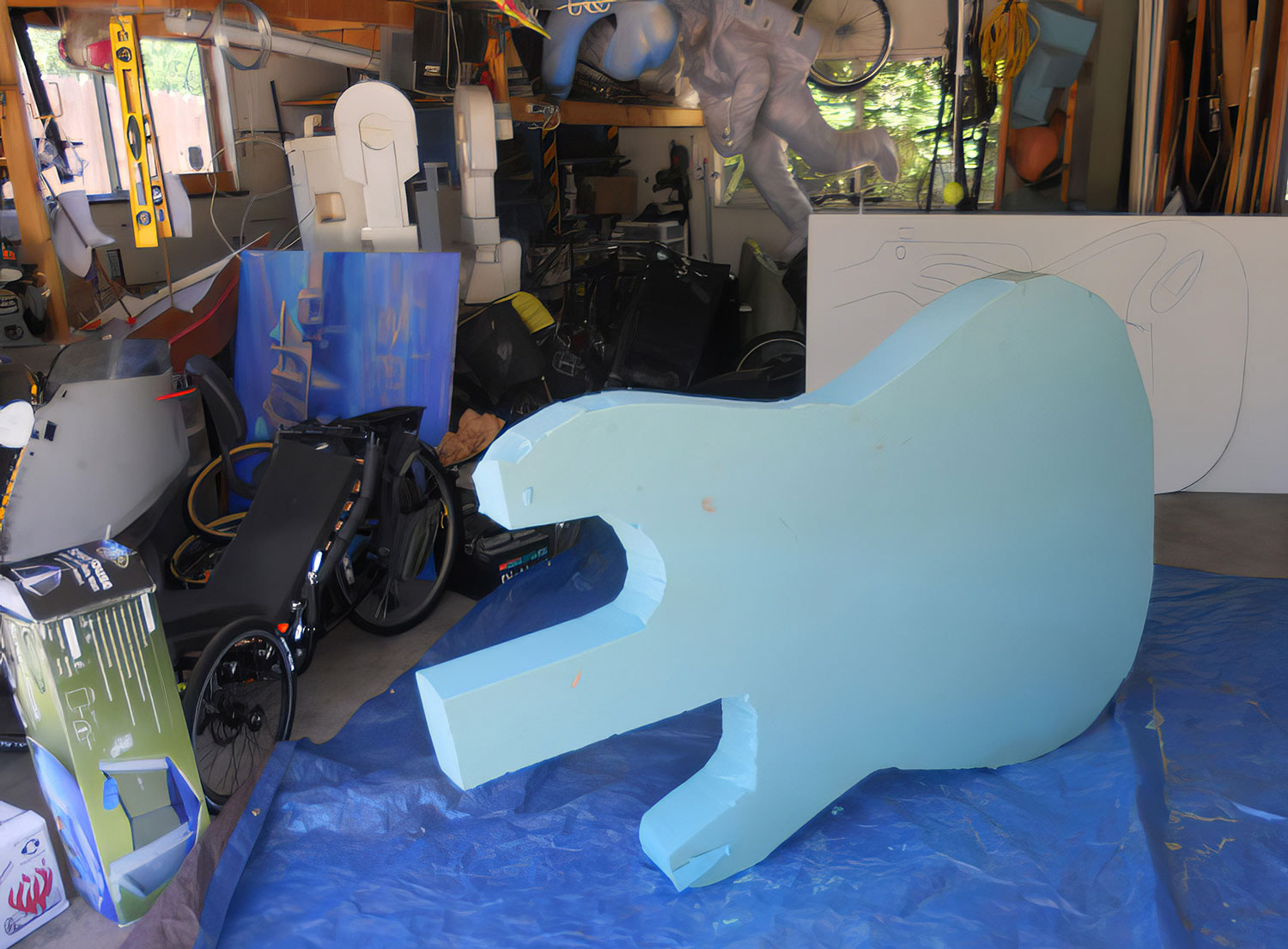 The body is 6’ long. I used an opaque projector to get the basic shape, then worked from my photographs to work the contours with a “cheese grater” made to shape Bondo, then sandpaper. 