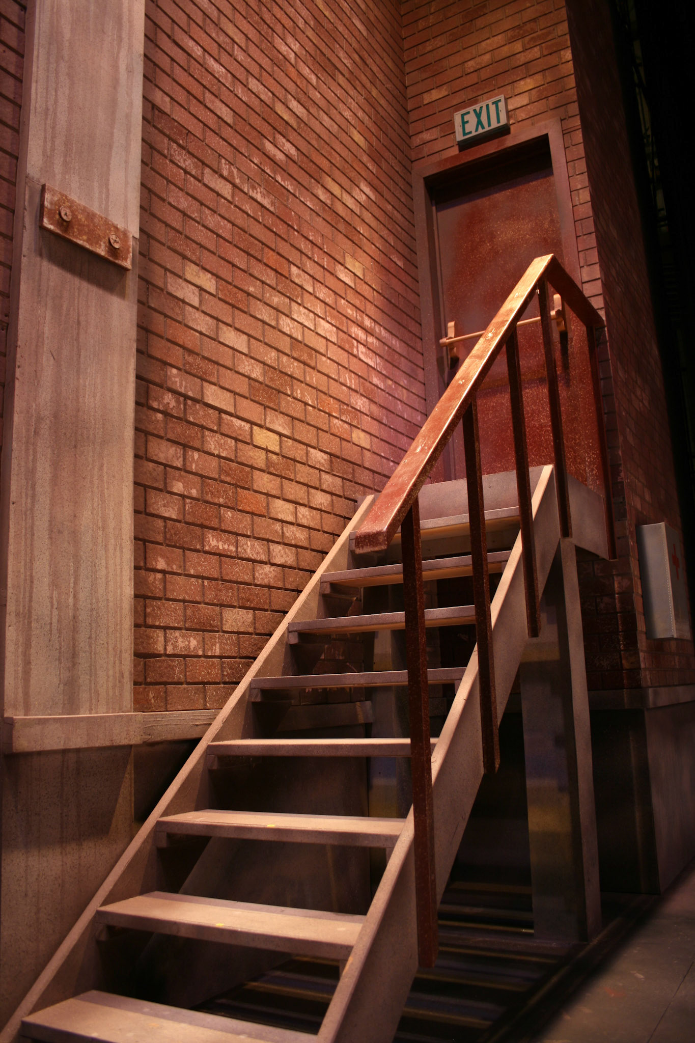 A critic said, "what is there to say about the back wall of the theatre?" Mission accomplished. It was a fake wall in front of the actual wall!