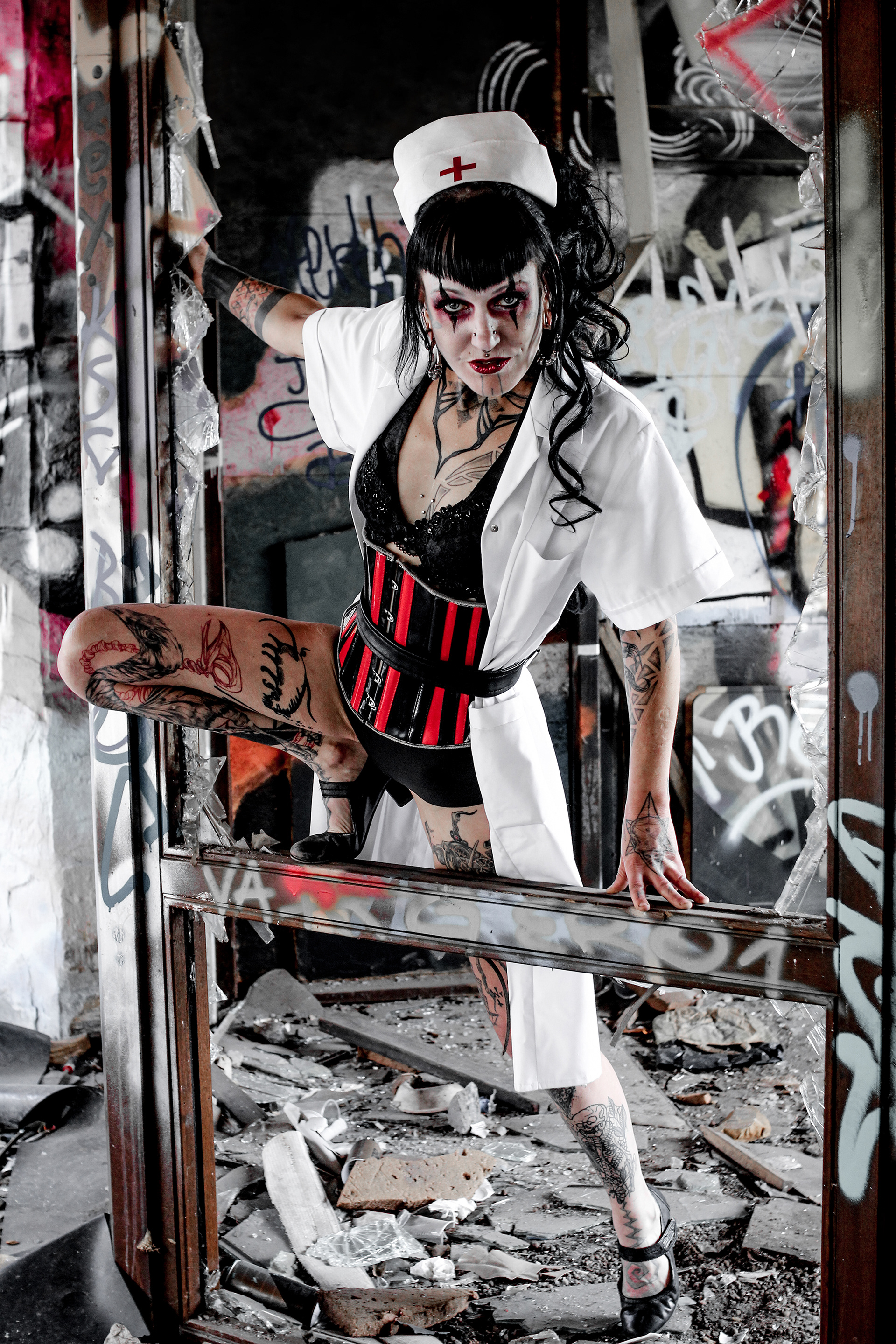 Performer Sabine Twedelera aka Princess Tweedle Needle in bloody horror nurse costume at abandoned water park Blub in Berlin
