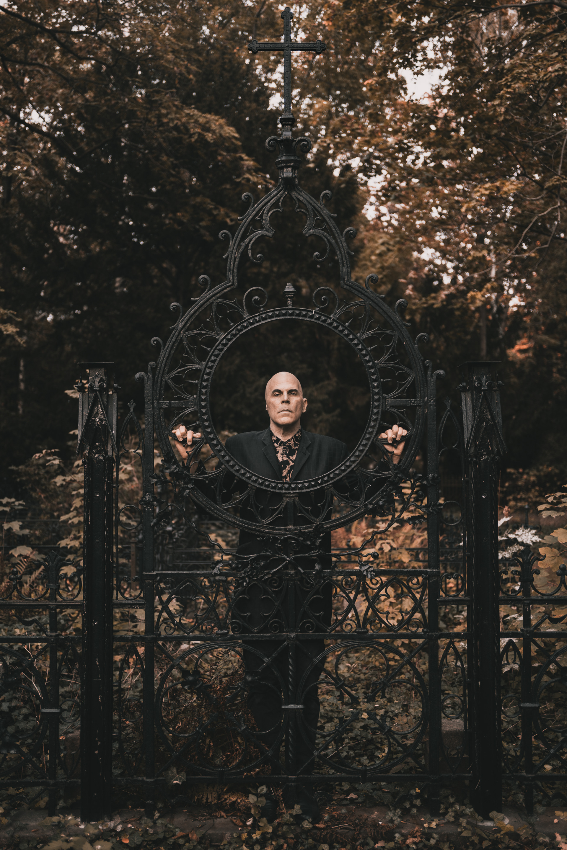 Nikolas Schreck american sinager and songwriter of death rock band Radio Werewolf standing in the cemetery in Berlin
