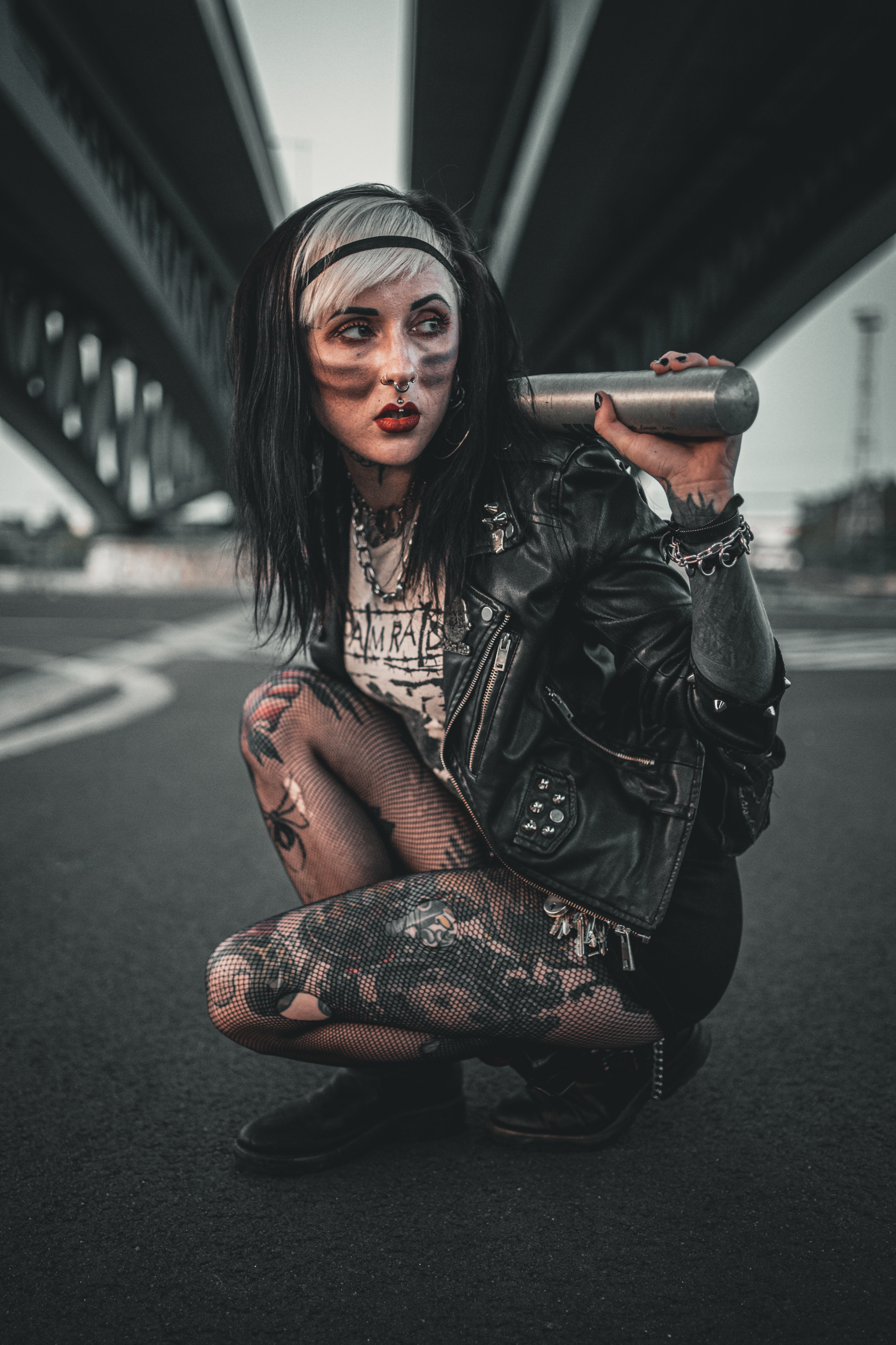 Lina RBL 'Never Look Back' shot under highway bridge in Berlin holding a baseball bat