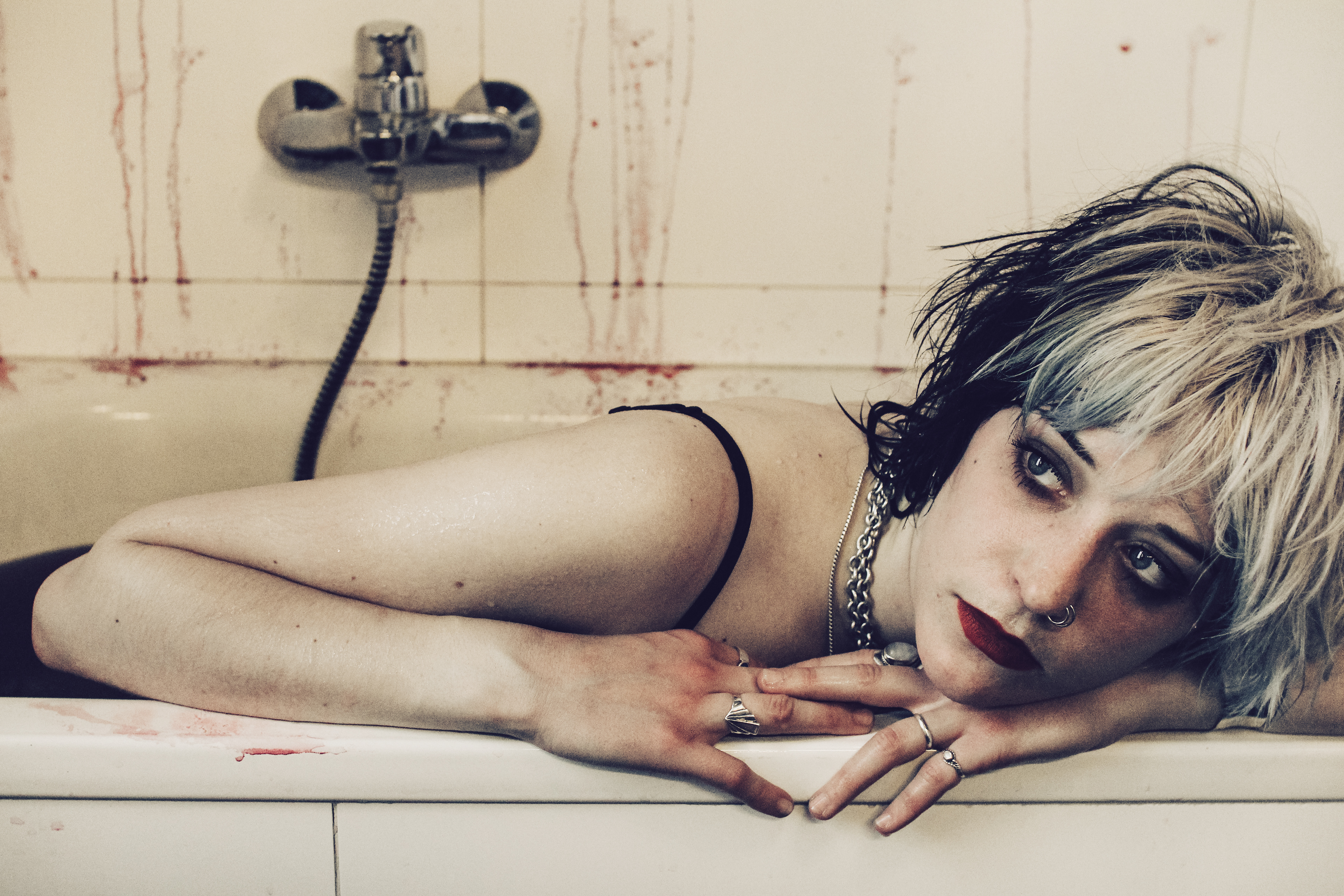 Saxophonist of dark punk band Totenwald Ruby having a blood bath