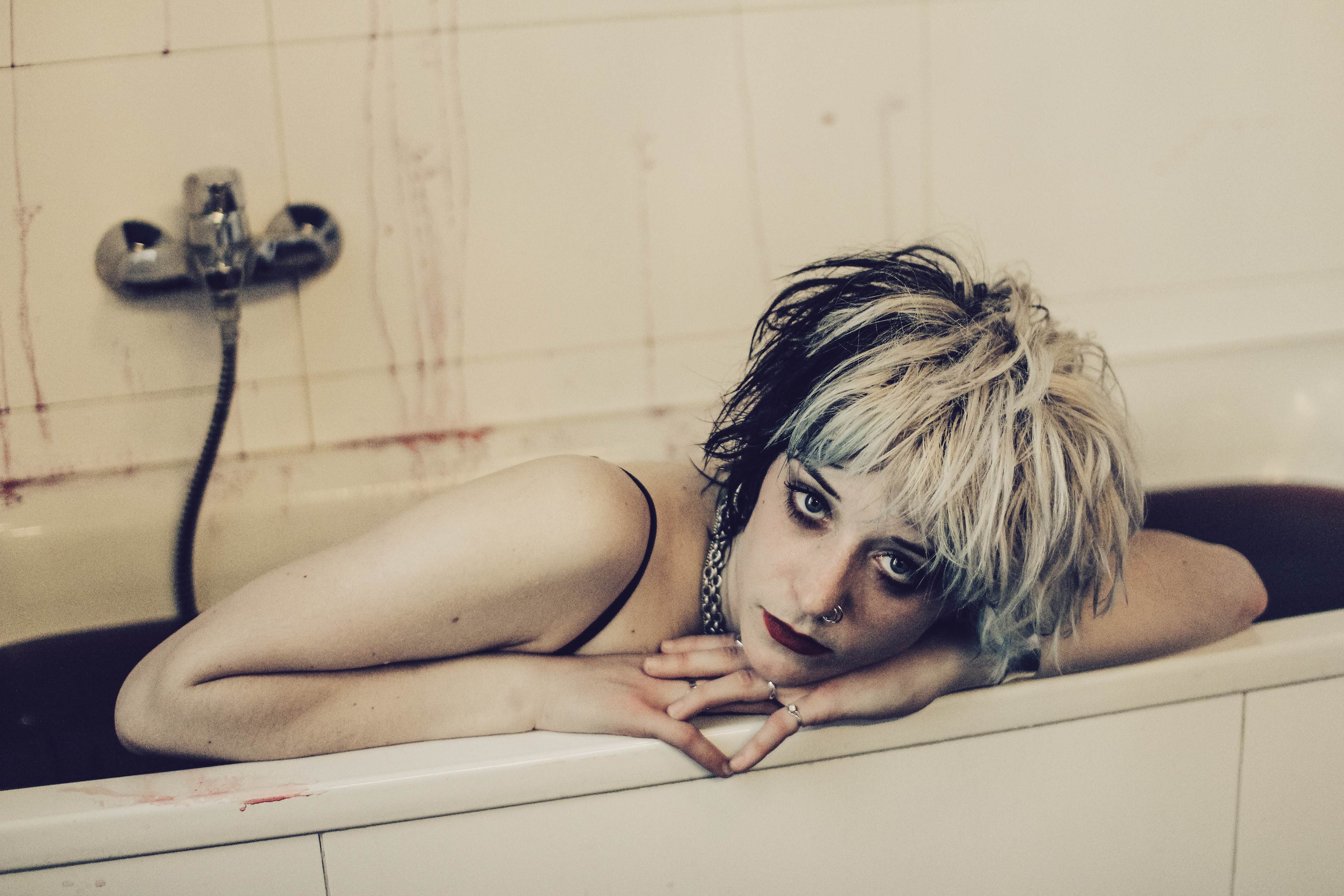 Saxophonist of dark punk band Totenwald Ruby having a blood bath