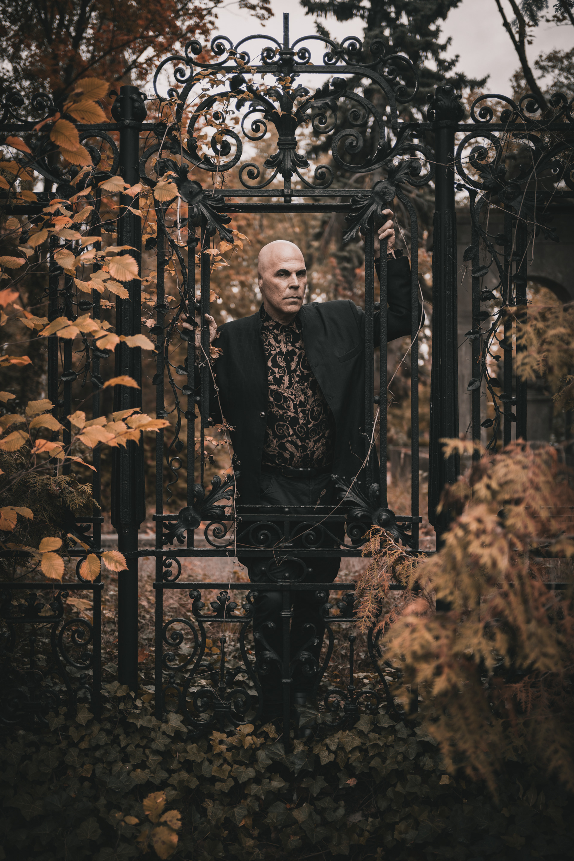 Nikolas Schreck american sinager and songwriter of death rock band Radio Werewolf standing in the cemetery in Berlin