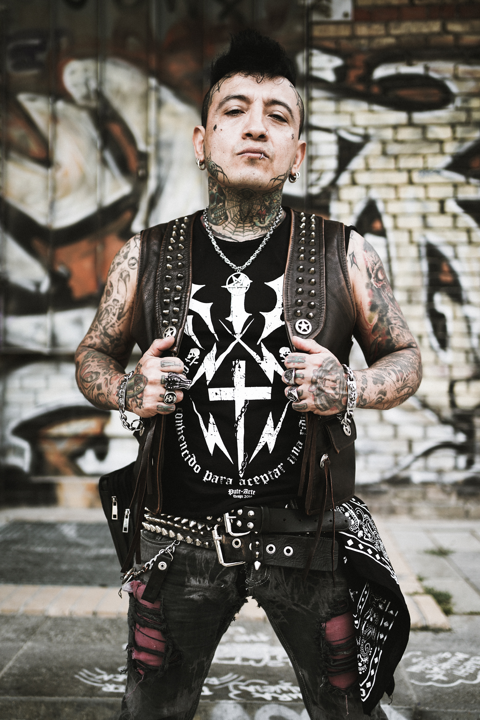 Chema Zurita the bass player of street punk band Booze & Glory sitting on the stairs in Berlin´s Görlitzer Park