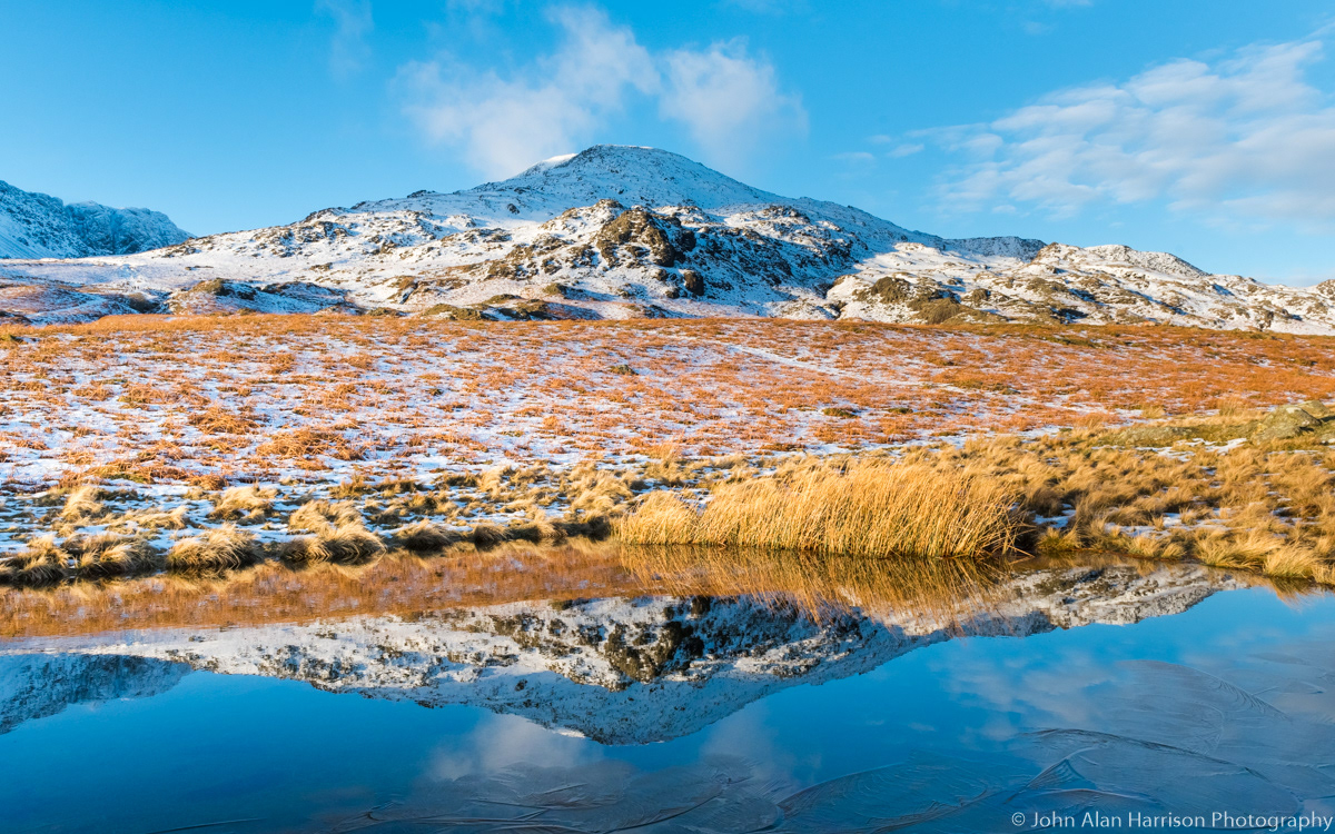 Coniston Old Man from the south. The little tarn in the foreground is an elusive thing, it disapears during dry weather.