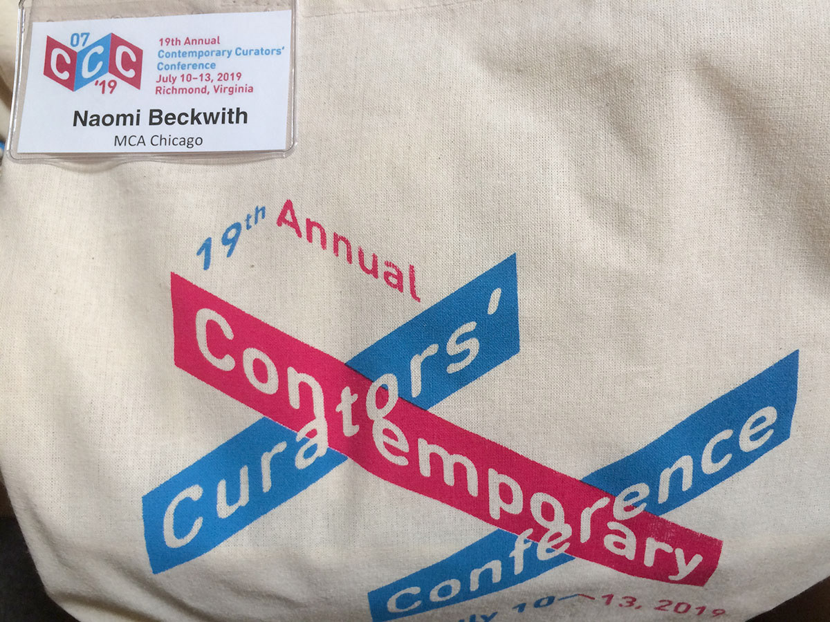 CCC name tag and cloth tote bag, with conference logo silk screened in two colors.