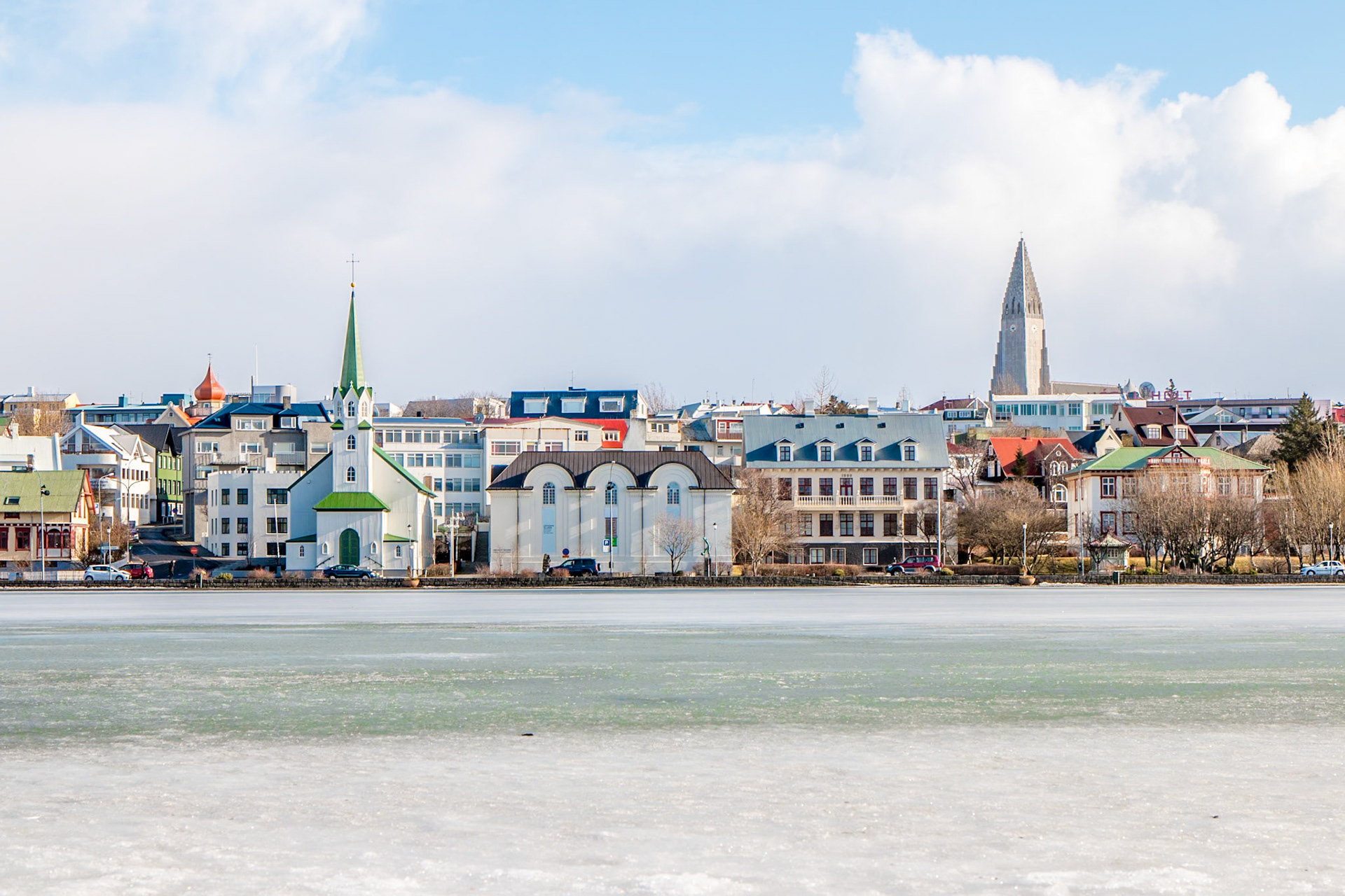 A frozen Lake Tjörnin on a cold Winter morning, Reykjavík, Iceland