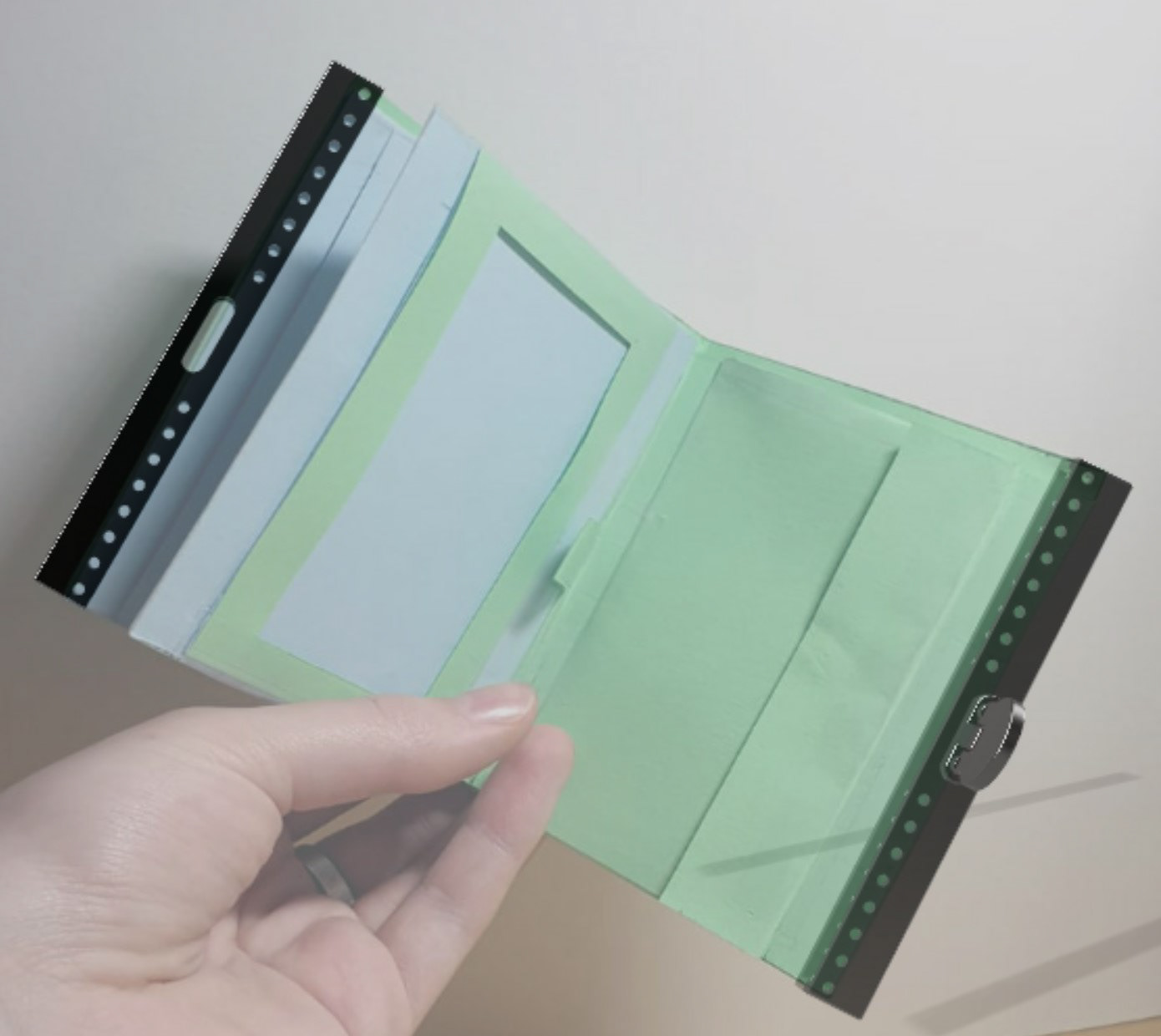CAD overlaid onto a paper model to show assembly.