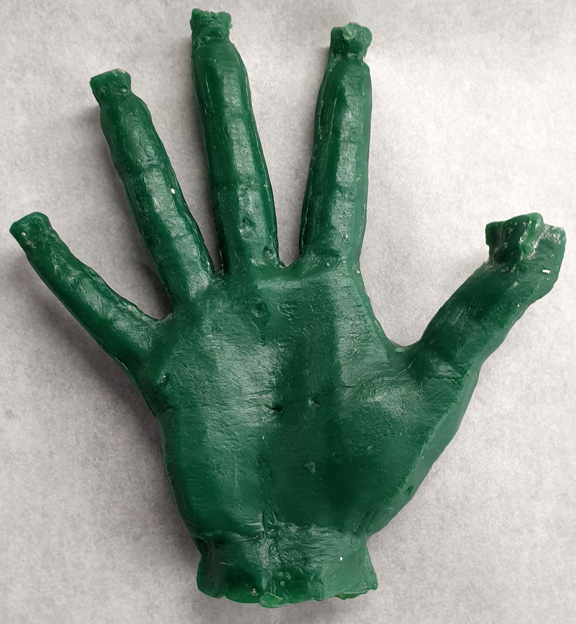 The wax cast being cleaned up & refined.