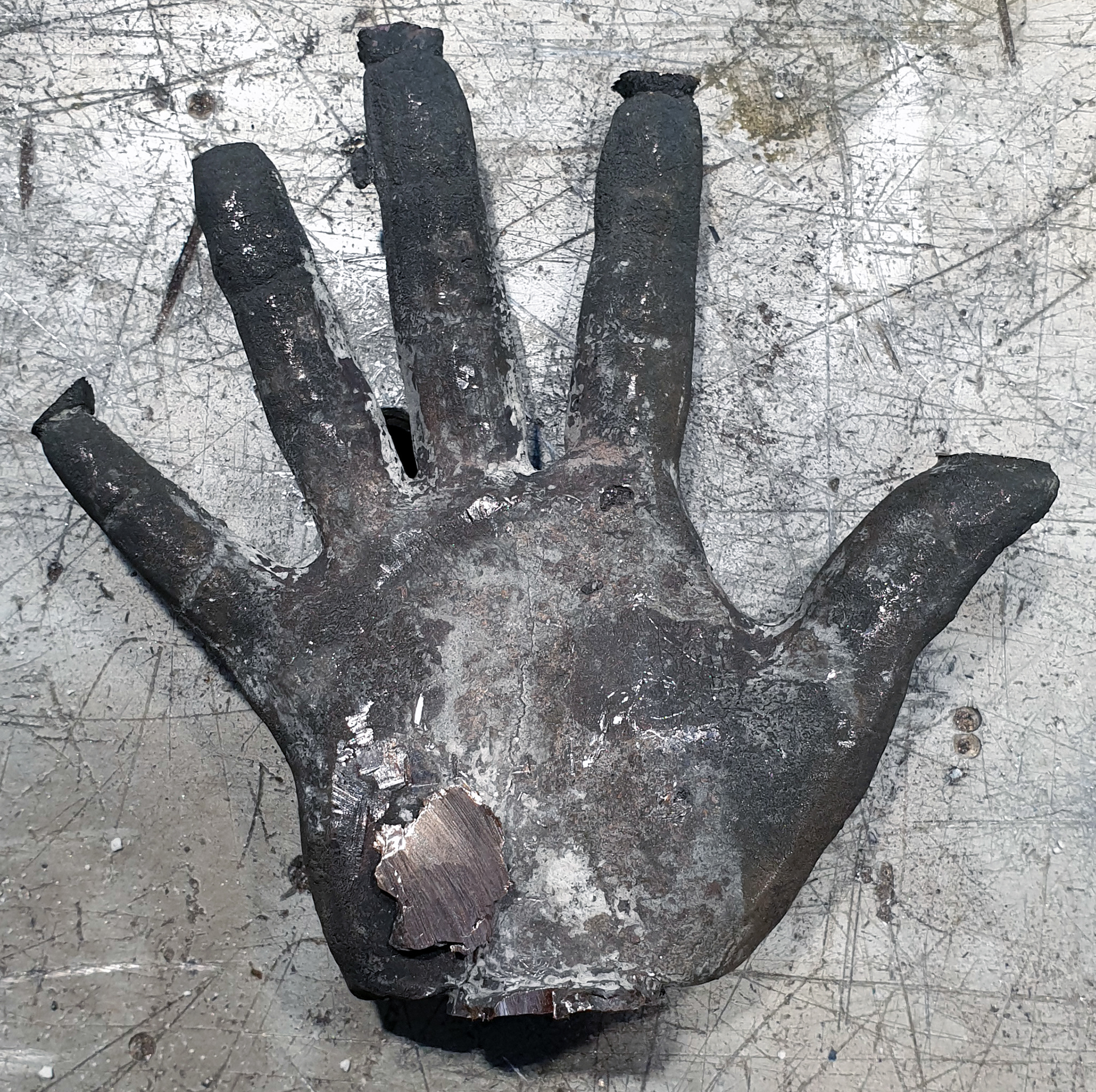 The resulting cast being cleaned up.