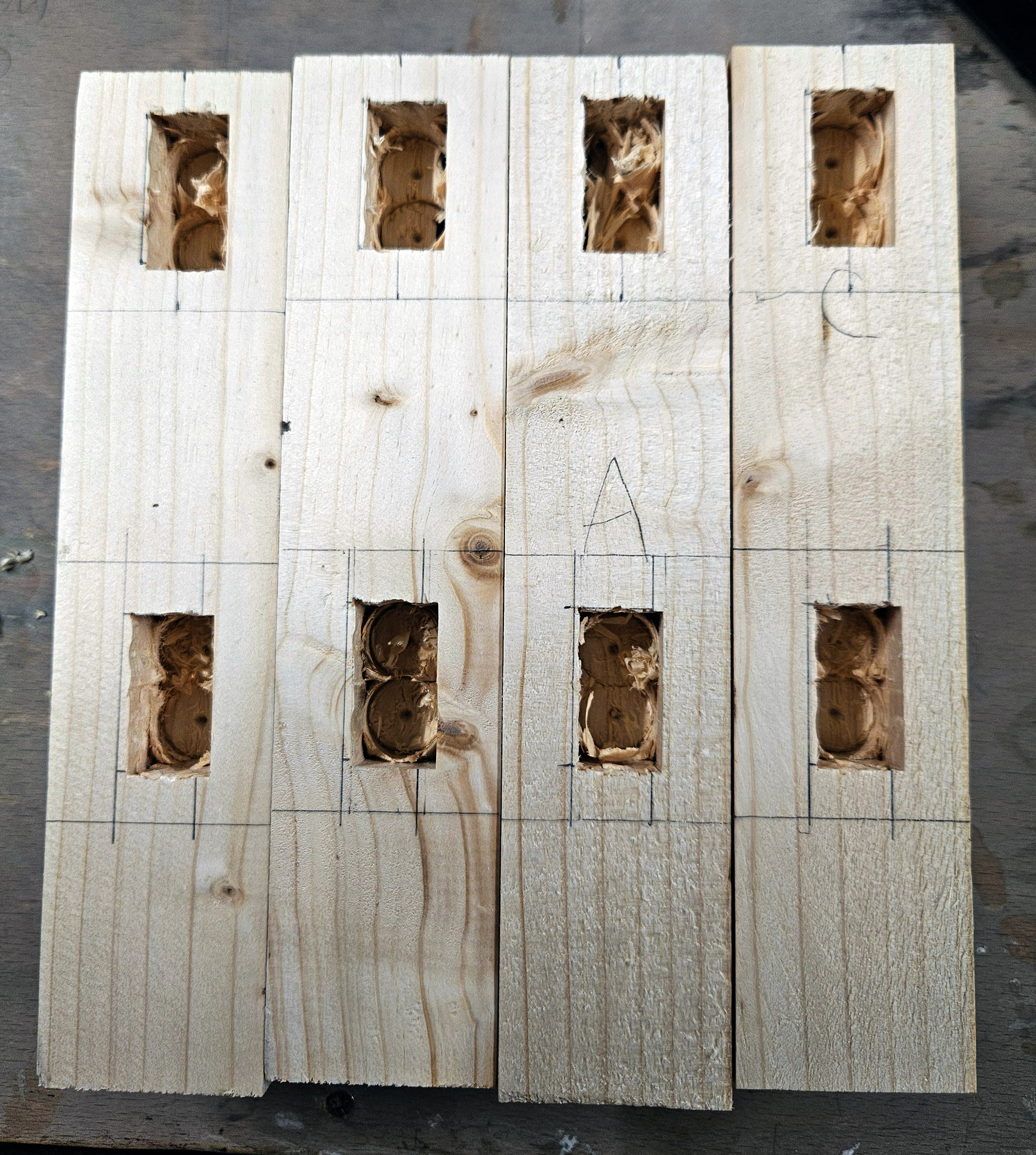 Mortise holes after the pillar drill, cleaned up with a chisel