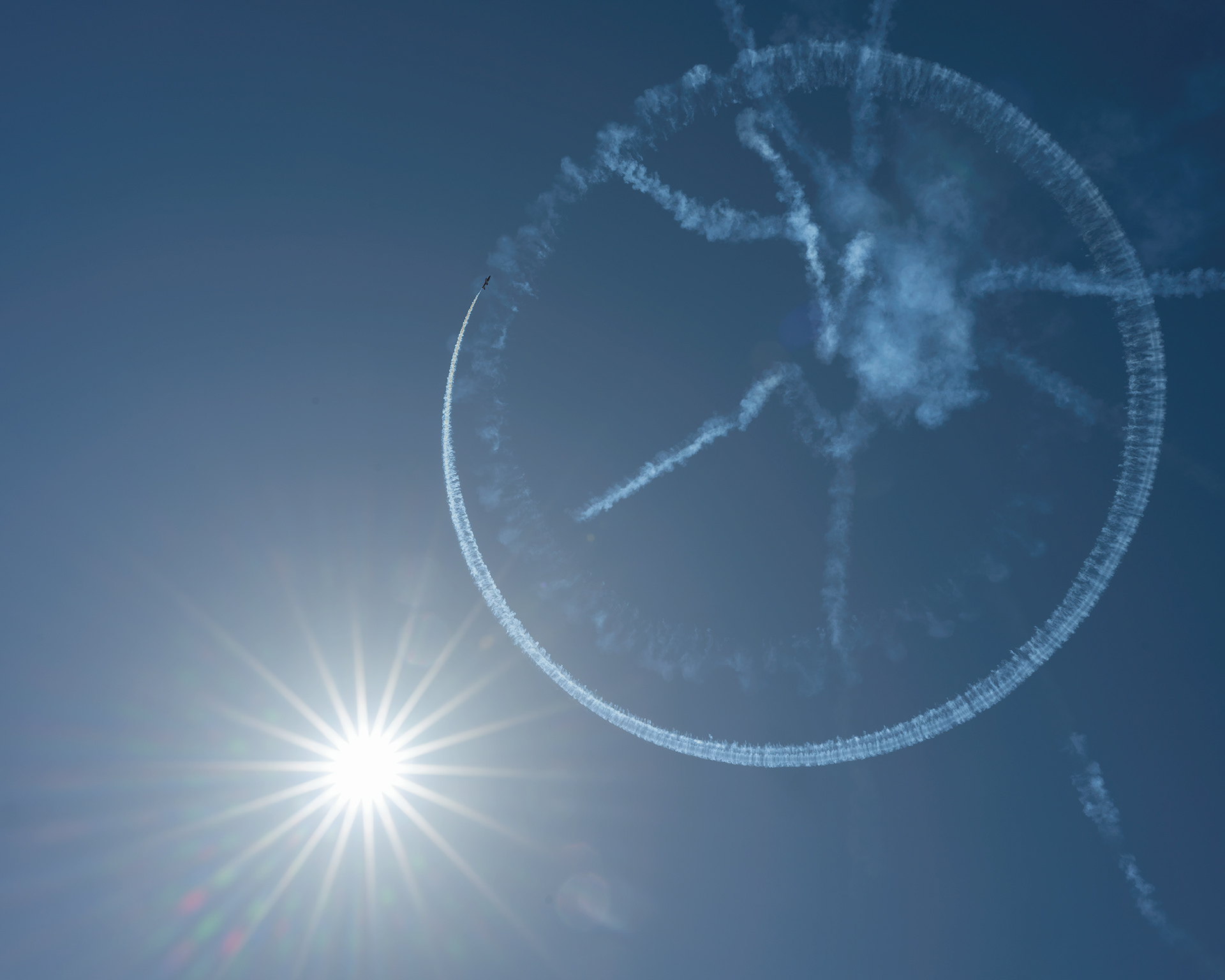 The Canadian Forces Snowbirds (431 Air Demonstration Squadron) perform a precision formation flight, leaving signature white smoke trails against a clear sky during their 2026 spring training demonstration over Vancouver Island. Fine art aviation photography by Kevin Prentice.