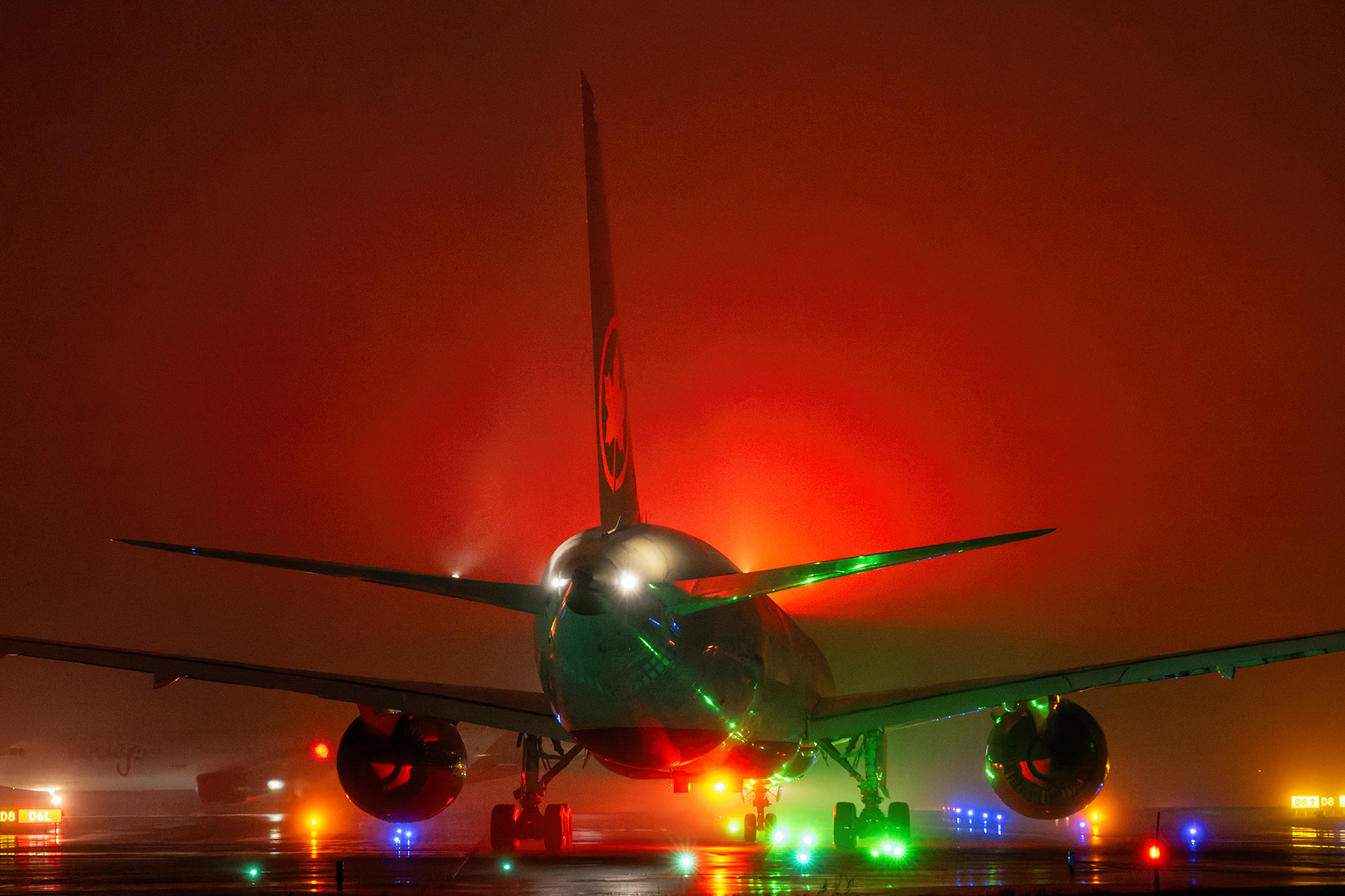 2024 Skies Magazine Grand Prize Winner: An Air Canada Boeing 787 Dreamliner commercial passenger airliner taxis through heavy night fog. Commercial aviation photography by Kevin Prentice.